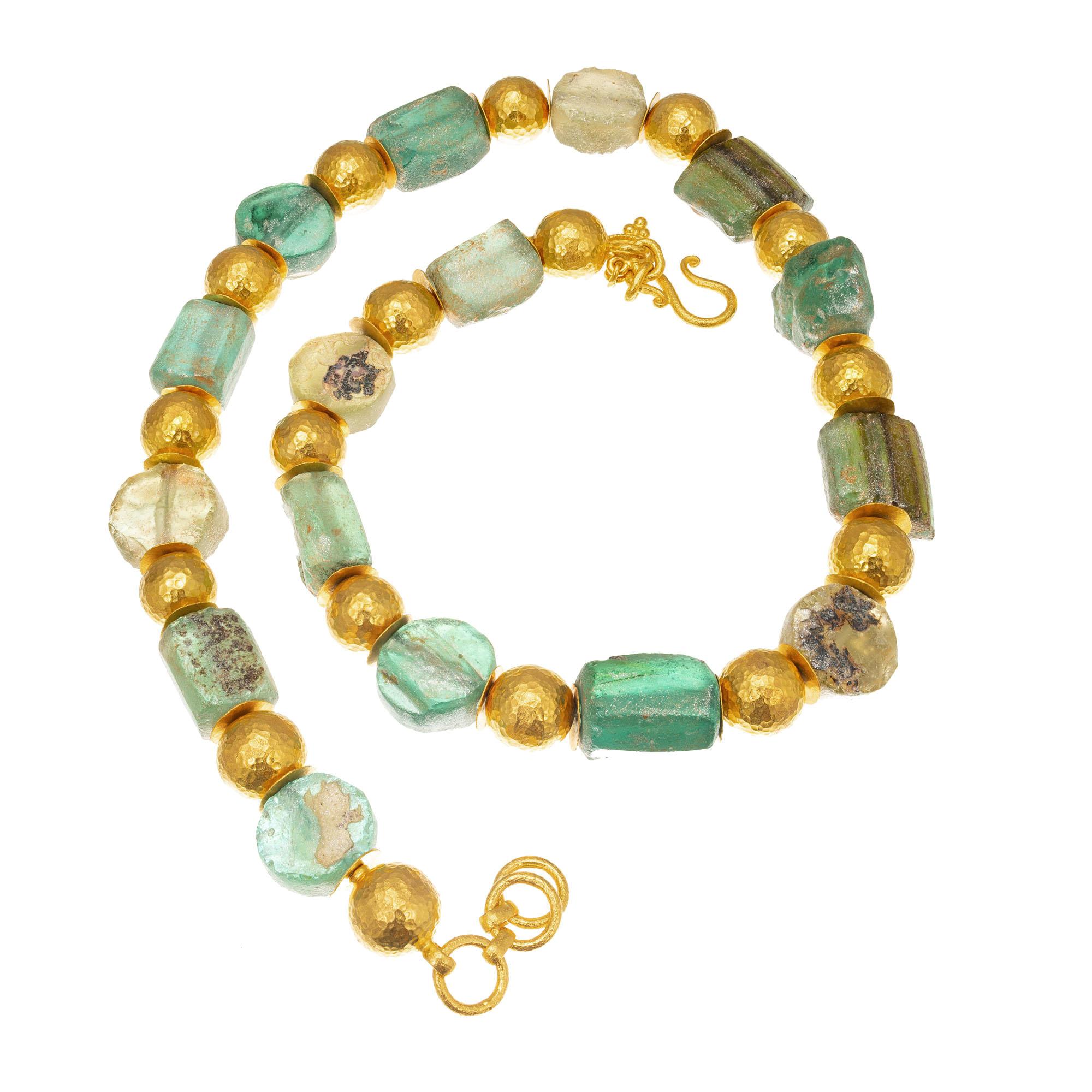 24k yellow hand hammered gold spheres spaced with authentic Ancient Roman glass beads showing a metallic patina from the oxidation of metals.  

22/24k yellow gold
Stamped: 985
Hallmark: ARA
84.4 grams
Top to bottom: 11.5mm or 9/16 Inch
Width: