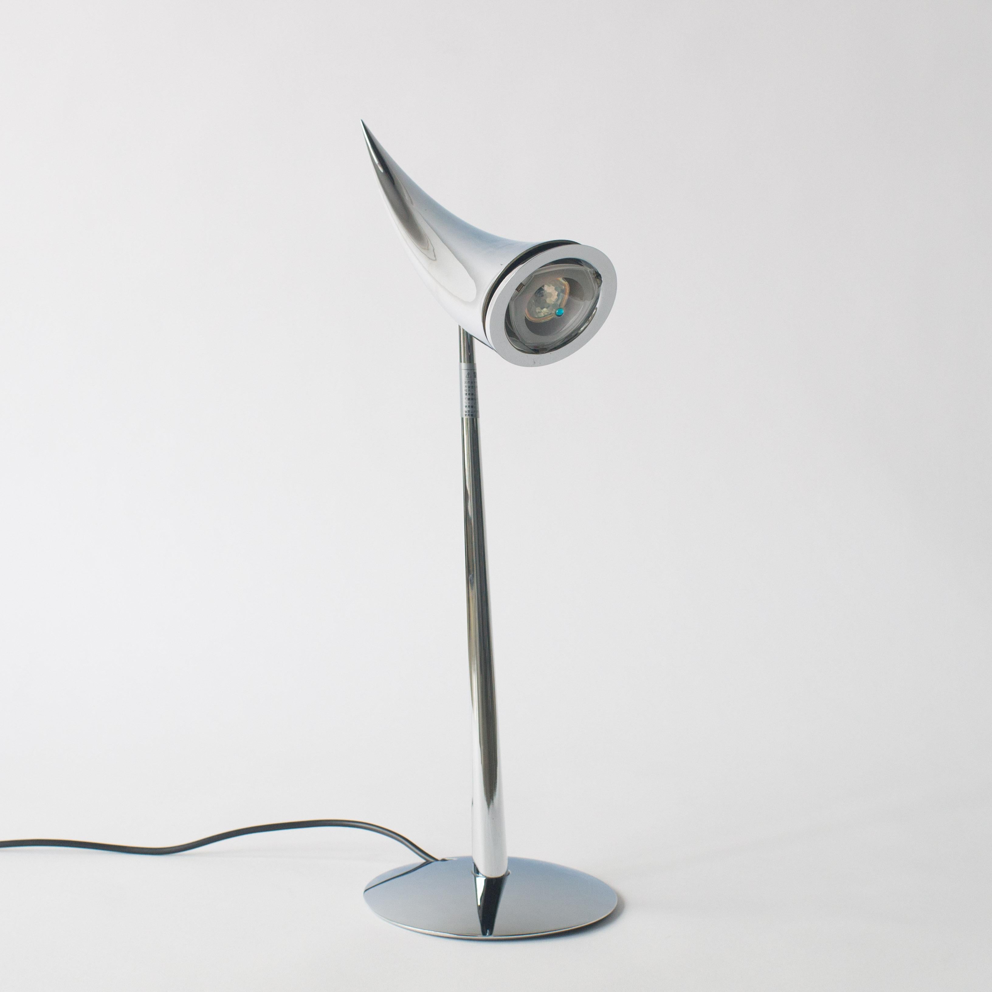 Ara desk lamp designed by Philippe Starck for Flos.
Usable with 100-120V, in the US.