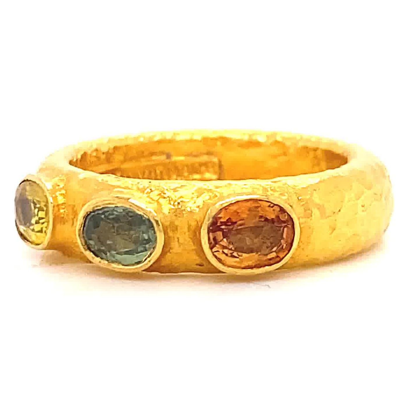 ARA985 Hand Made Sapphire Three Stone Yellow Gold Textured Ring. The three yellow, orange and blue sapphires weigh approximately 0.35 carats each. Crafted in 24k gold. Signed ARA985 hand made. Circa 2000s. Size 6 1/2 and may be re-sized.

About The