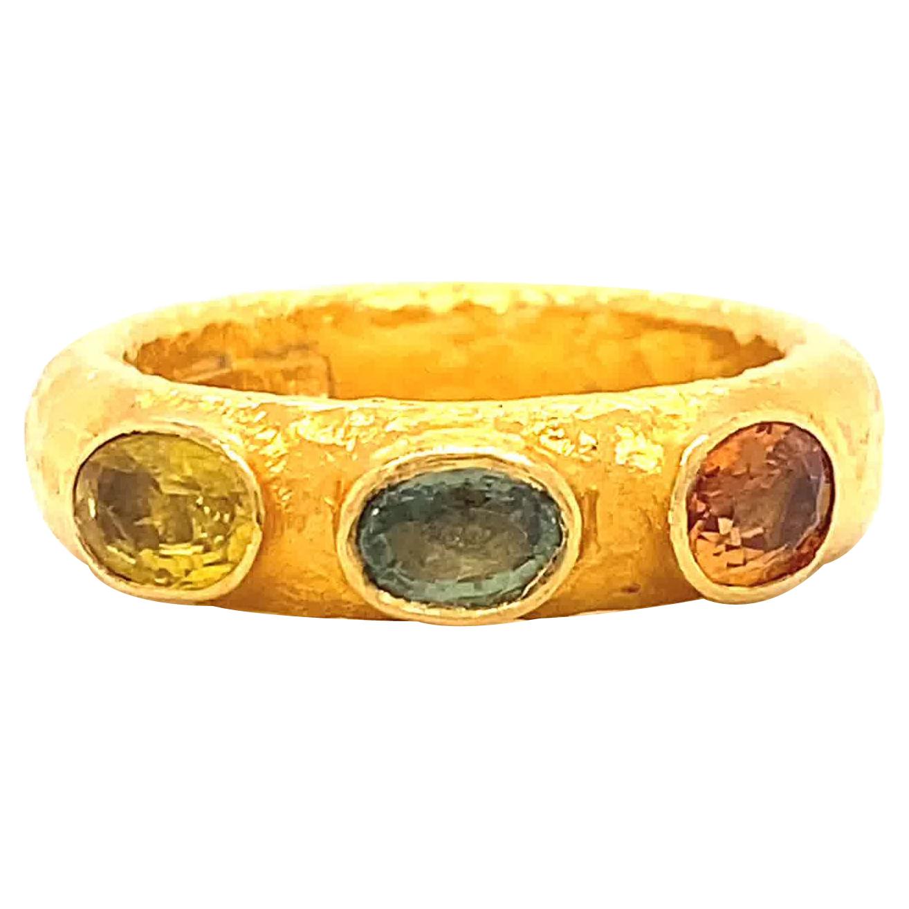 ARA985 Hand Made Sapphire Three Stone 24 Karat Yellow Gold Textured Ring
