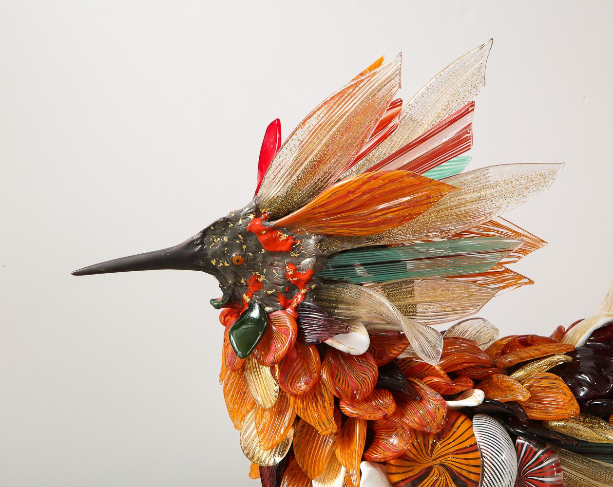 Glass and bronze sculpture. Work made with applied feathers in opaque and transparent polychrome glass produced directly by Toni Zuccheri in 2007. The base and skeleton are in lost-wax cast bronze made in 1987 by Fonderia Opere d'Arte O. Brustolin