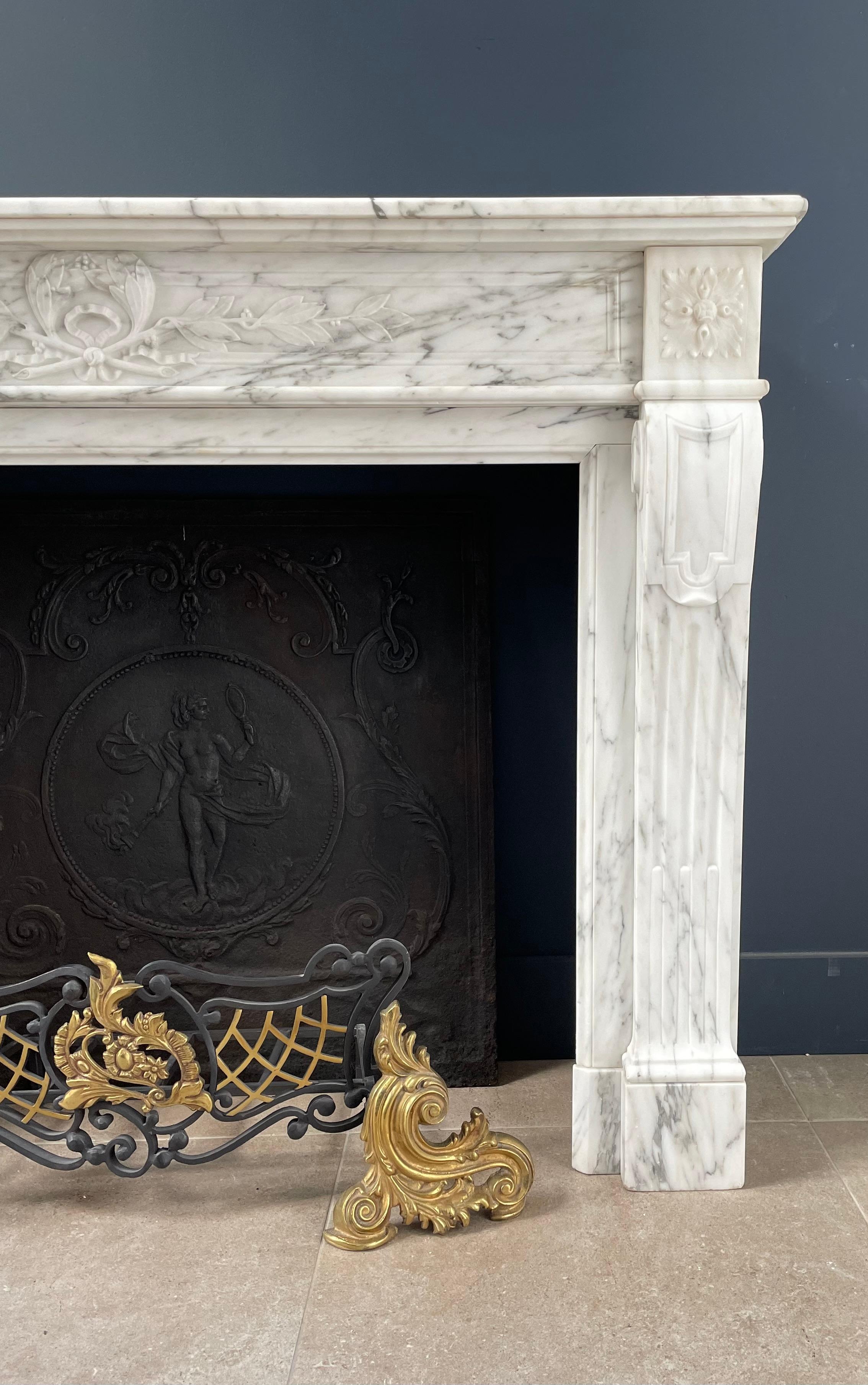 Experience the exquisite beauty of our French Antique Fireplace, meticulously crafted from elegant Arabescato marble, to bring a touch of timeless charm to your space.

Immerse yourself in the allure of this fireplace, where graceful lines blend