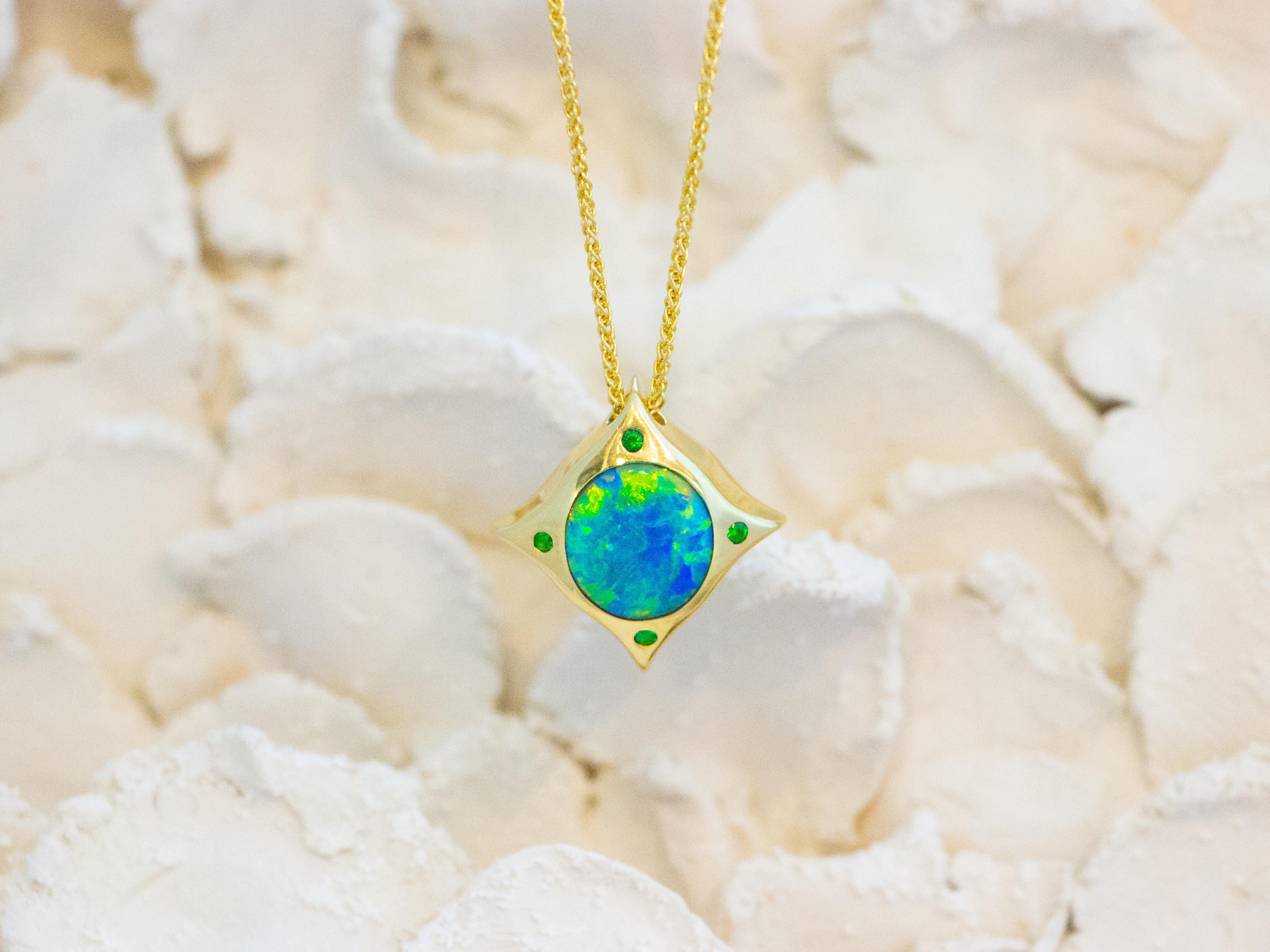 Compass Pendant. Wear this pendant everyday as a talisman. Mine to market solid 2.57 carat Australian Lightening Ridge opal set in hand fabricated 18 karat recycled gold bezel with tsavorites at the points. 
Dimensions: 1.9 cm x 1.8 cm x 0.6 cm
