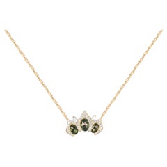 Arabesque 18k yellow   Gold Pendant with green Sapphires and Round Cut Diamonds