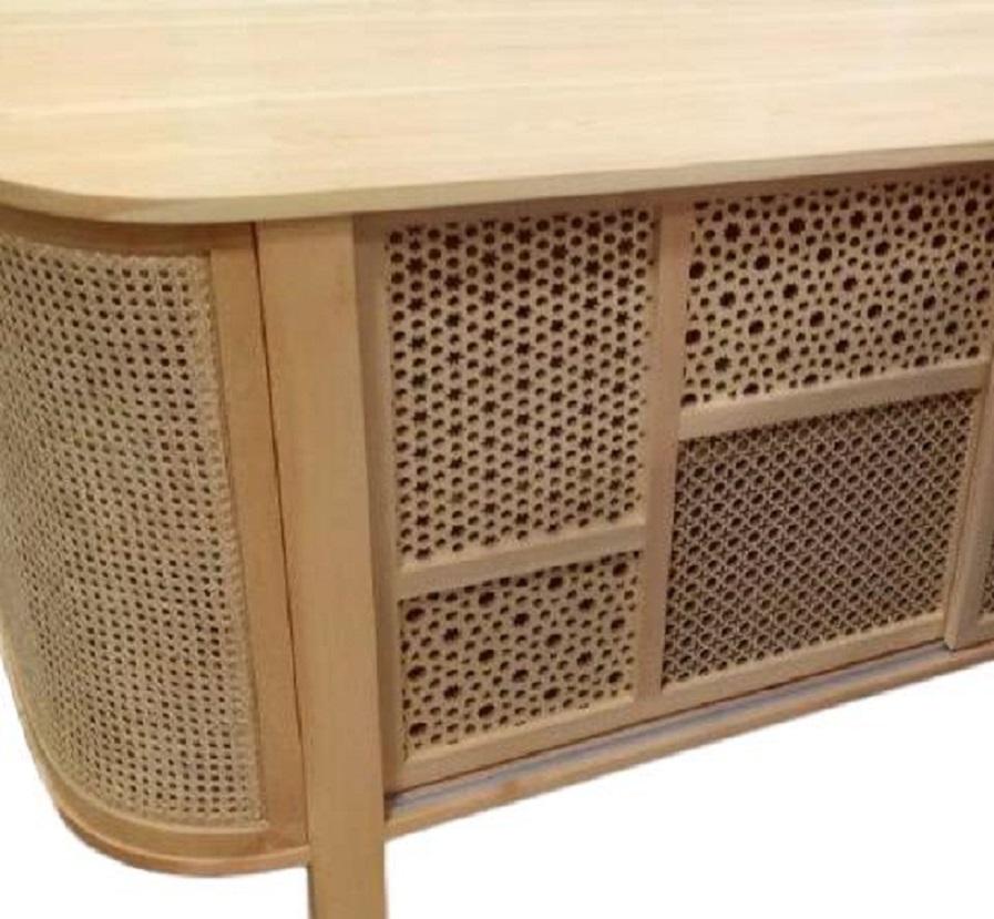 The frame is constructed of solid wood with natural woven cane sides.
The sliding doors are made of wood veneer to match the body of the sideboard and they are laser cut to create a collage of arabesque patterns that complement the rattan