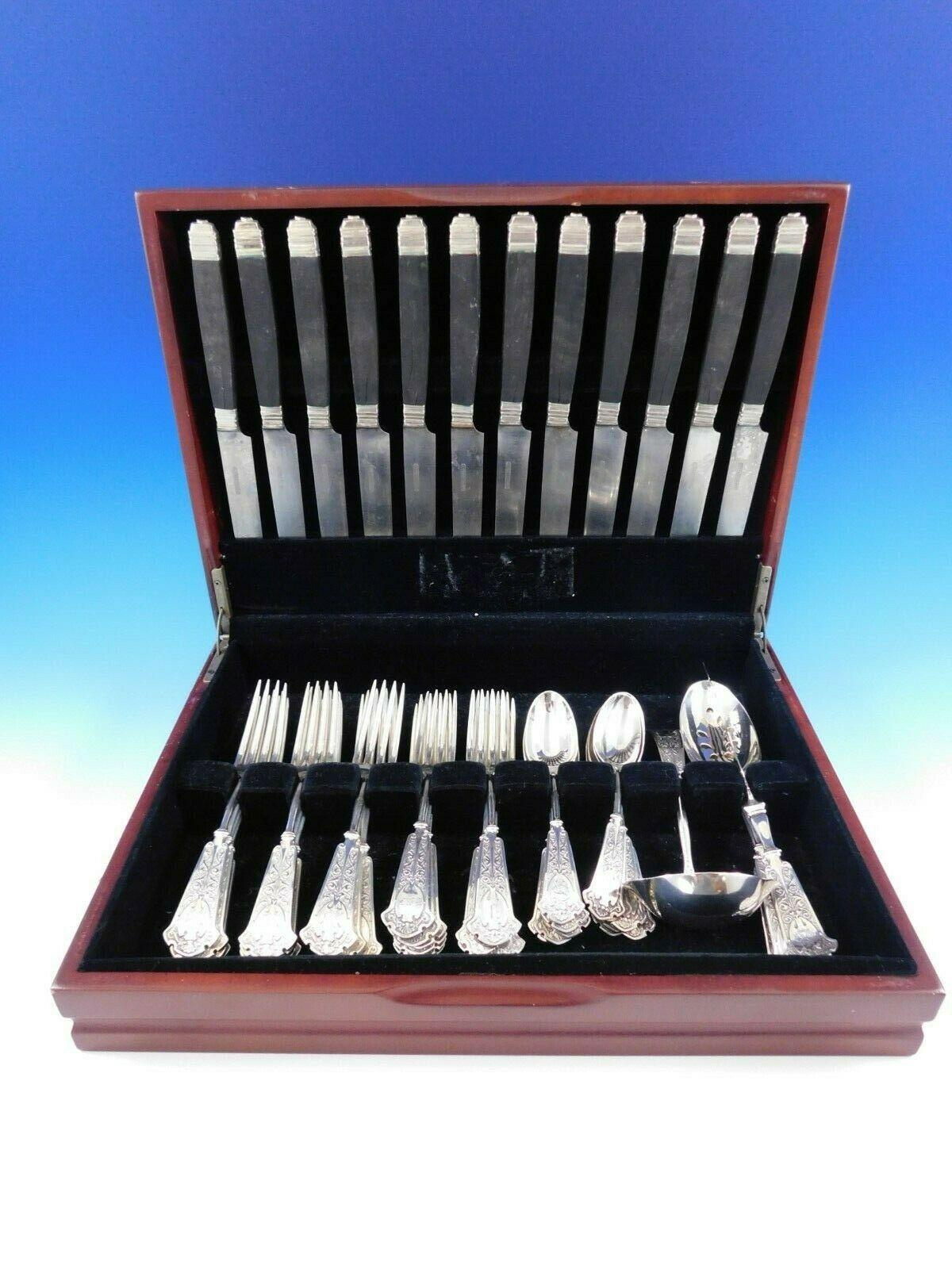 Rare Moresque by Wendt sterling silver flatware set - 52 pieces, circa 1873. This set includes:

12 Dinner knives, Ebony handles, 9 3/4