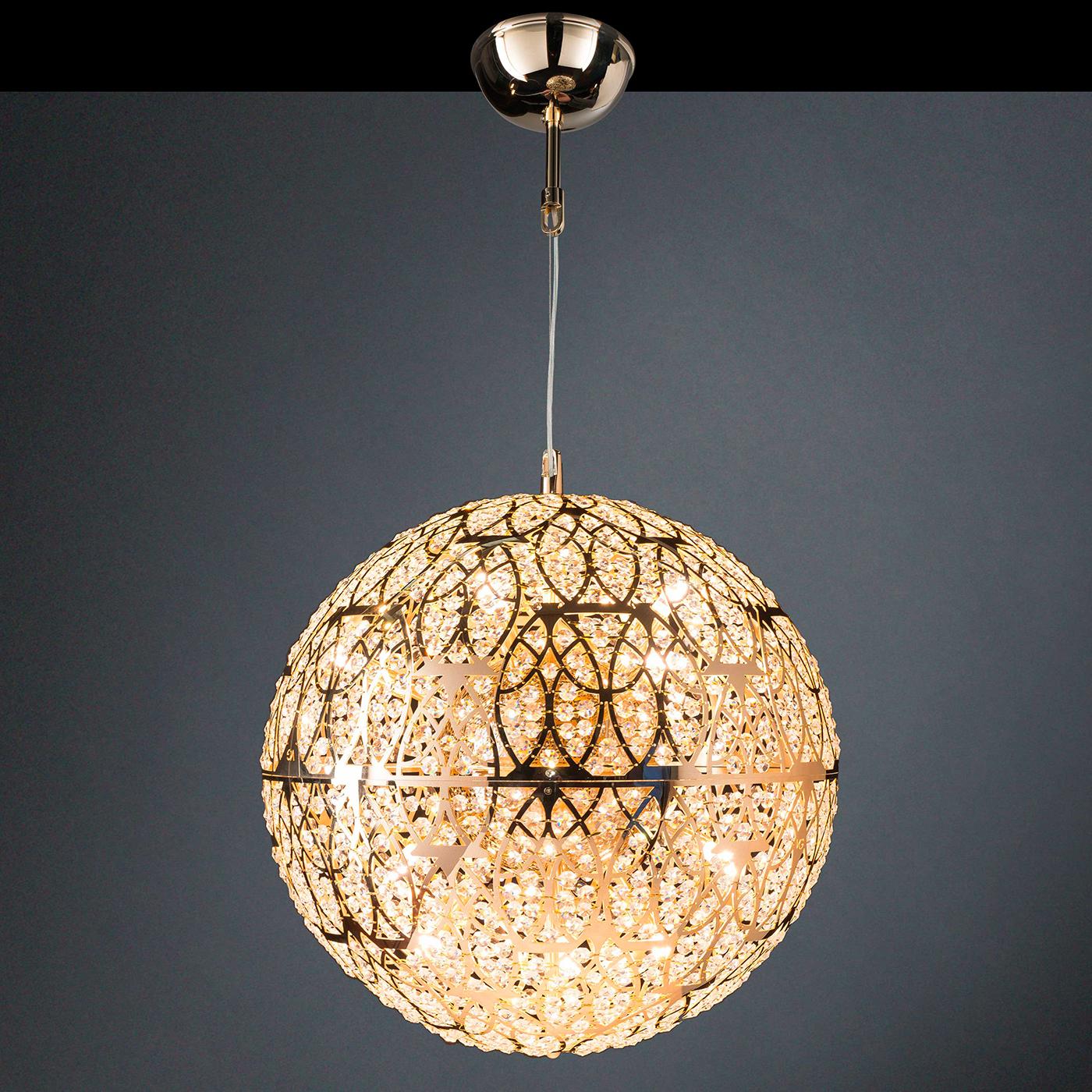 A superb object of functional decor, this pendant lamp celebrates light in a perfect spherical shape. It is crafted of glossy chrome-finished steel elements waded together and functioning both as supporting structure and mounting for the myriad of