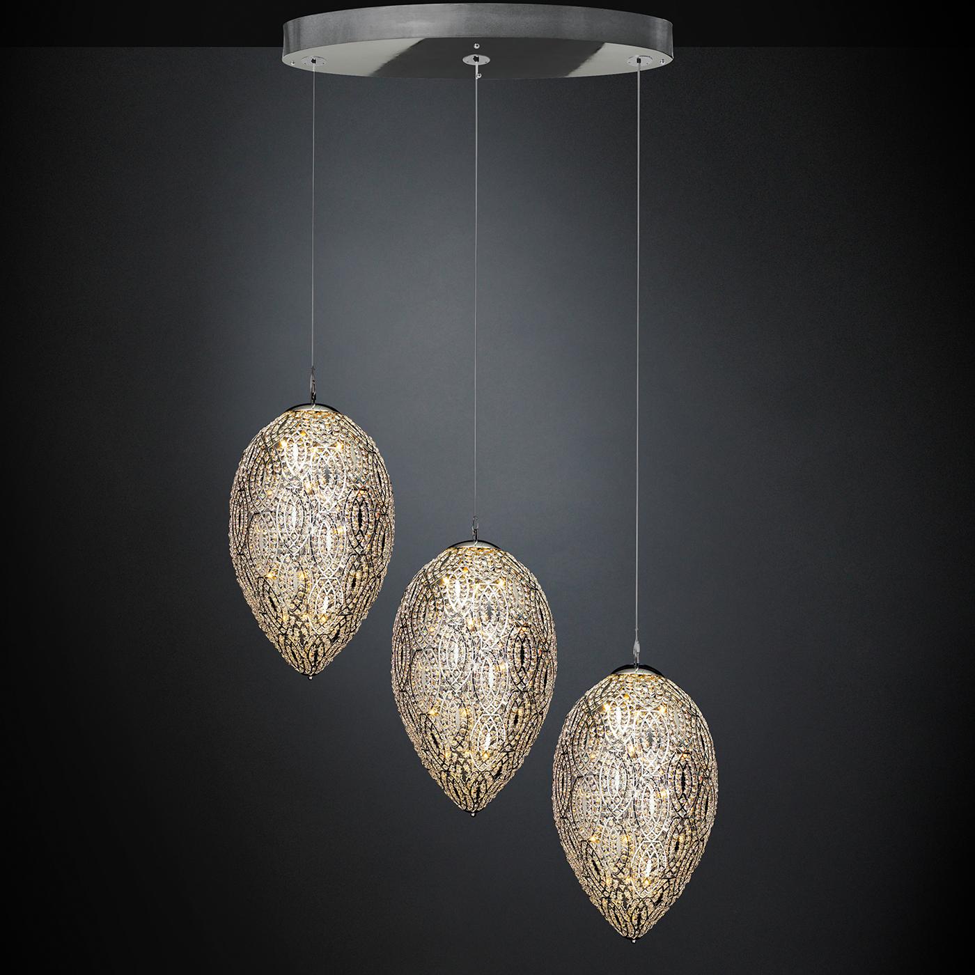 The epitome of luxury, the Arabesque Collection combines the sparkling transparency of the multi-faceted Asfour crystals applied by hand on the chromed steel leaf-shaped pendants showcasing an intricate pattern of interlaced lines. Featured with