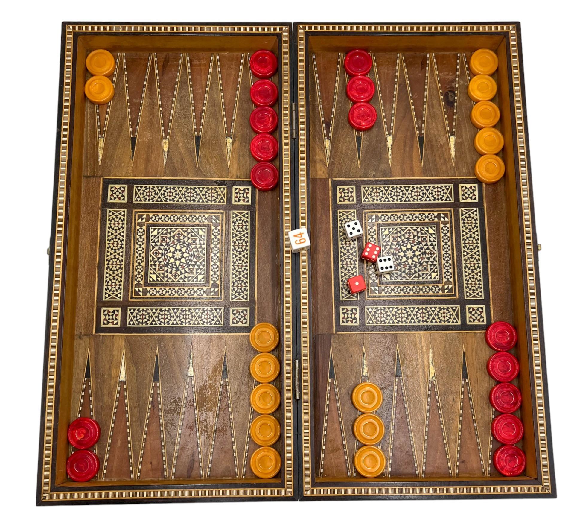 Experience the artistry of Middle Eastern craftsmanship with this exquisite hinged box featuring intricate mother-of-pearl marquetry in a micro mosaic design. This elegant piece opens to reveal a meticulously crafted backgammon game board, complete