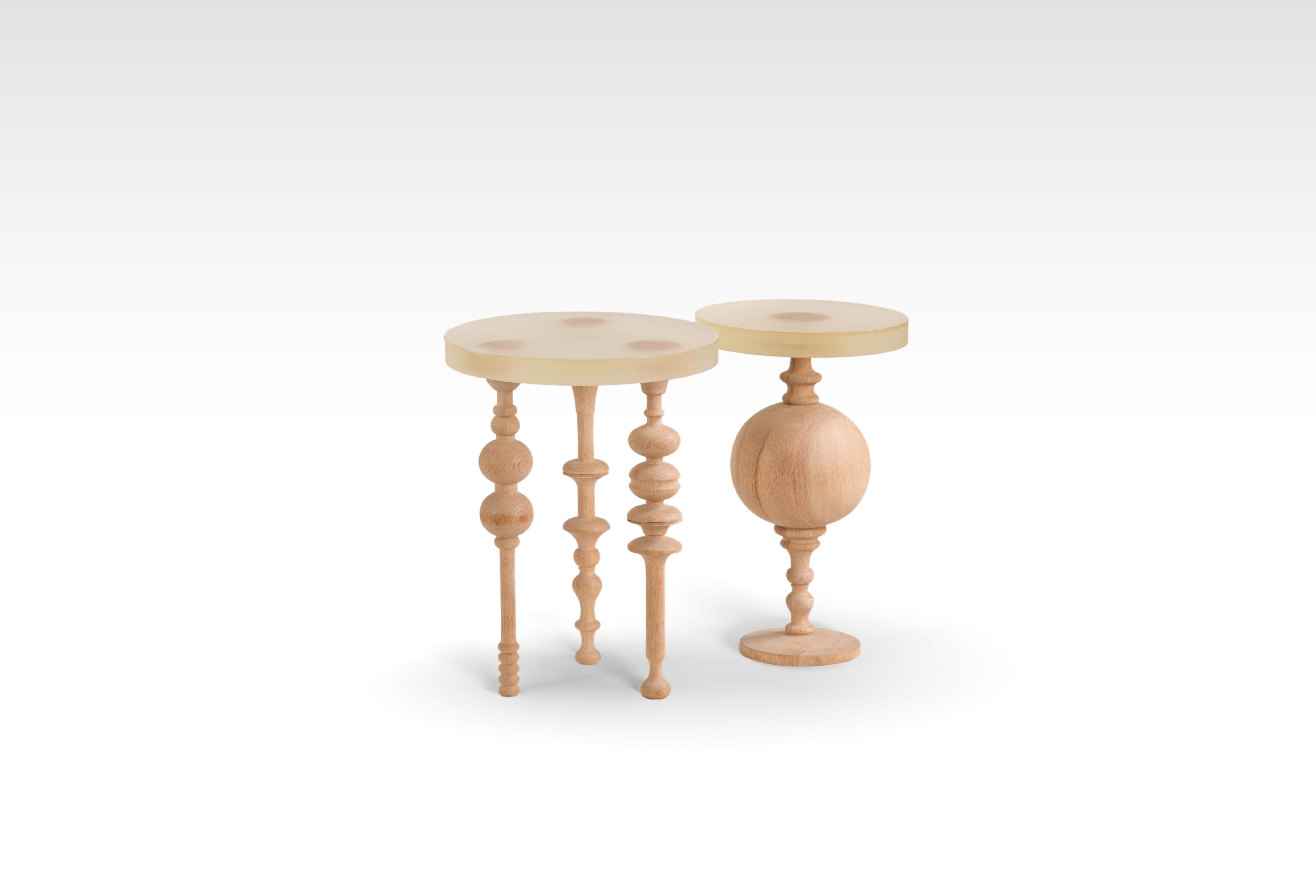 Arabesque-Inspired Oak Wood Side Table set with Resin Top. Our Funky Fusion is a classic side table with a contemporary flare that brings character to your living space. The tables are made of Oak wood legs and resin tops, giving it a raw and