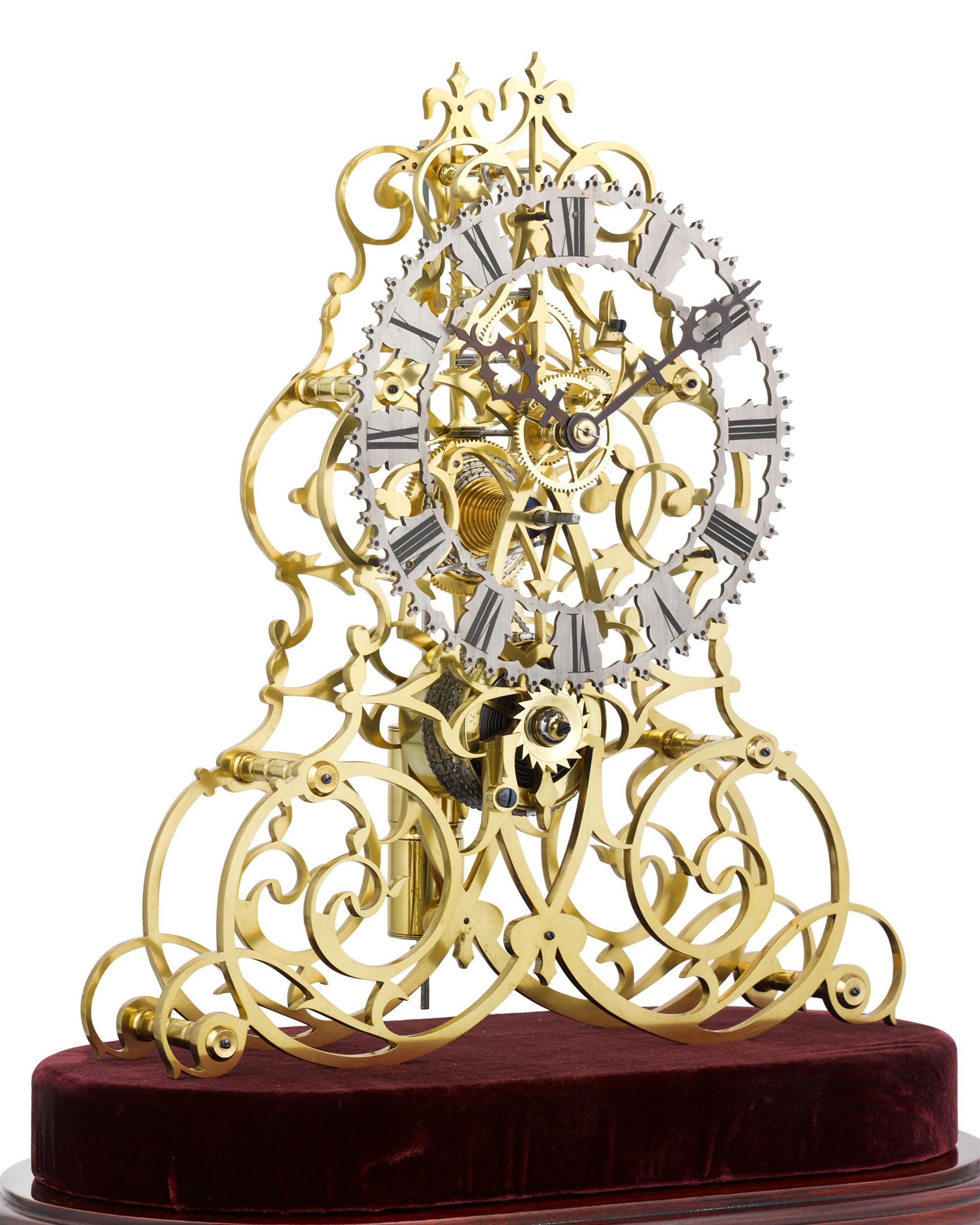 This incredible brass arabesque skeleton clock is an outstanding example by the preeminent English firm of William Frederick Evans of Handsworth, Birmingham. This horologic masterpiece is in complete, working condition, powered by an 8-day movement.