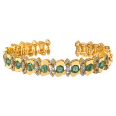 Ruwaya Yellow gold green sapphire bangle  with Diamonds