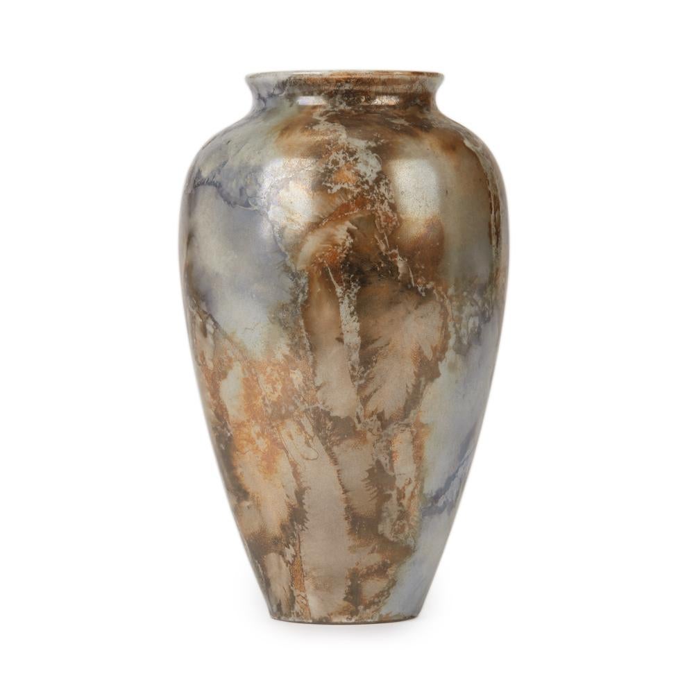 A stunning Art Deco Finnish Arabia art pottery vase of bulbous shape decorated in silver and brown lustre glazes in a marbled effect. The earthenware vase has a narrow rounded base and has printed makers marks and is numbered 181.