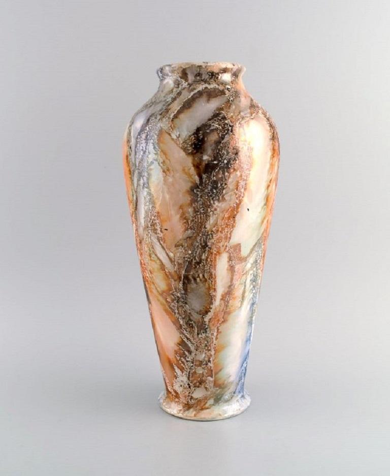 Arabia, Finland. Large Art Deco vase in glazed faience. 
Beautiful marbled glaze. 1920/30s.
Measures: 36.5 x 16.5 cm.
In excellent condition.
Stamped.