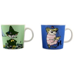 Arabie:: Finlande:: deux tasses en porcelaine avec des motifs de "Moomin"