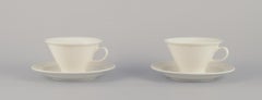 Arabia, Finland, Two sets of "Harlekin" tea cups and saucers in white porcelain.