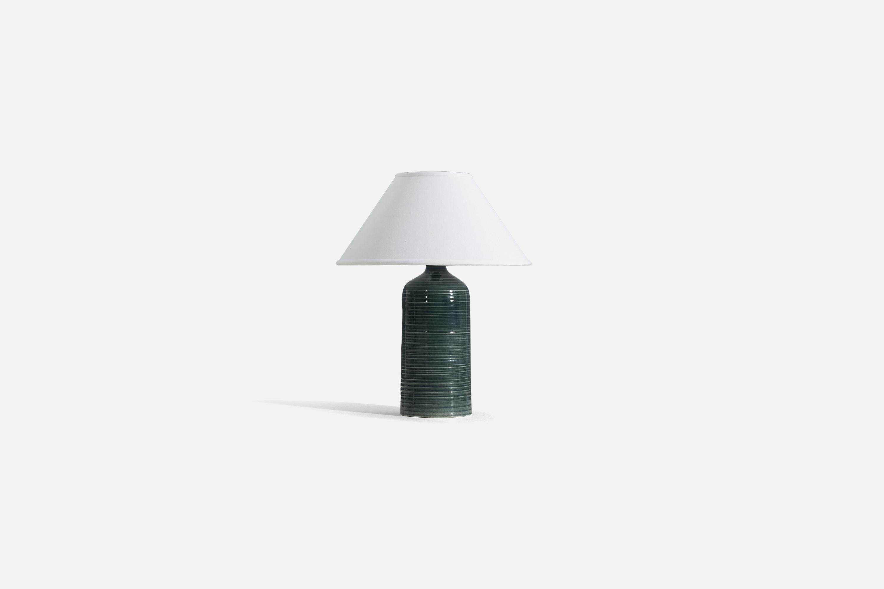 A green glazed and incised stoneware table lamp, produced by Arabia, Finland, c. 1950s.