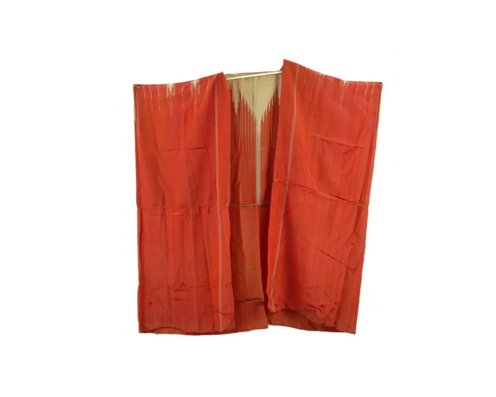 A vintage Arabic Islamic Moroccan red and gold silk robe. Flowing fabric with a unique pattern. A vibrant red background adorned with subtle golden accents. Can be draped and used for traditional costume. Vintage and Modern Eastern Textiles,