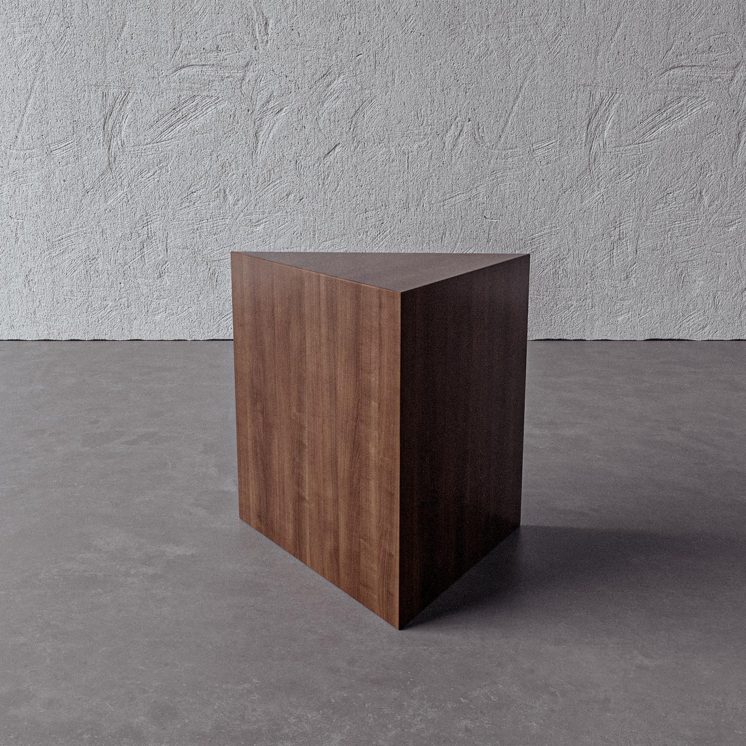 This solid wood triangular design reinterprets the tradition of sculpture as an artful side table. Handmade by artisans in Vietnam, this modern, functional piece is beautiful on its own or grouped with Galois and Appell.