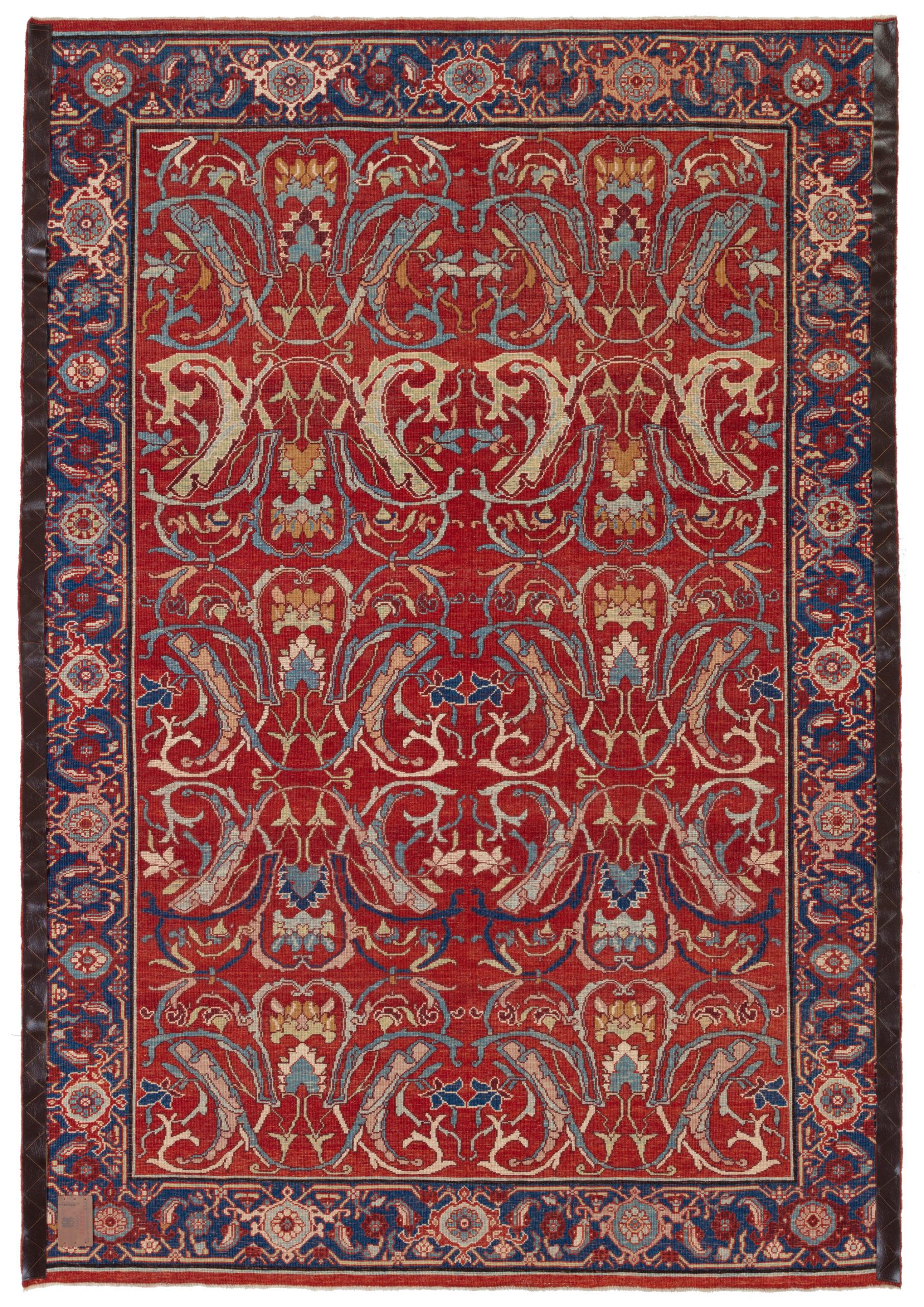 This is a repeat of large sweeping arabesques in muted colors adorning the red field rug designed in the early 20th century that originates from the Bidjar region in northwestern Iran. Bidjar rugs, in general, are renowned for their exceptional