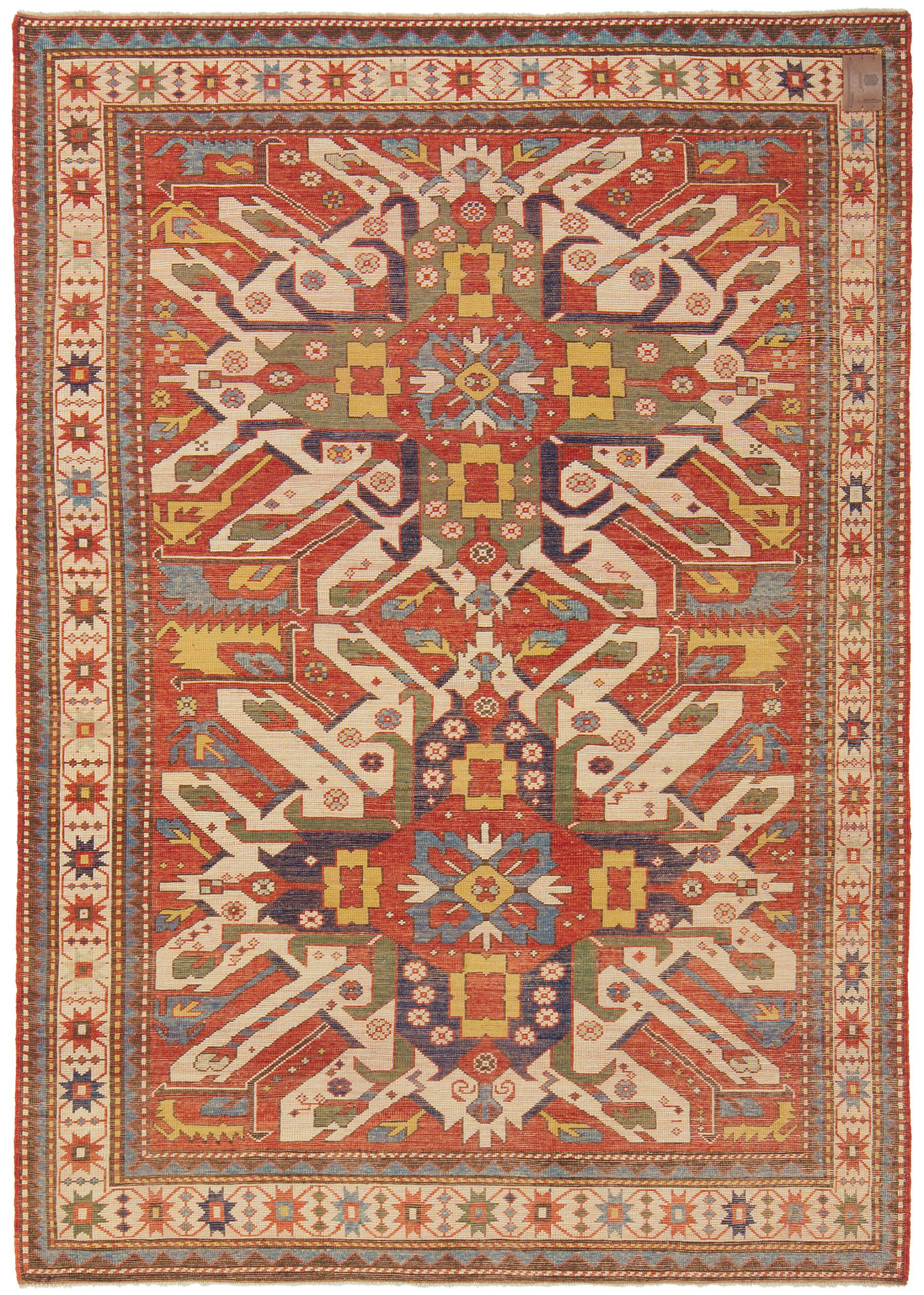 The design source of the rug comes from the book Tapis du Caucase – Rugs of the Caucasus, Ian Bennett & Aziz Bassoul, The Nicholas Sursock Museum, Beirut, Lebanon 2003, nr.29 and Oriental Rugs Volume 1 Caucasian, Ian Bennett, Oriental Textile Press,