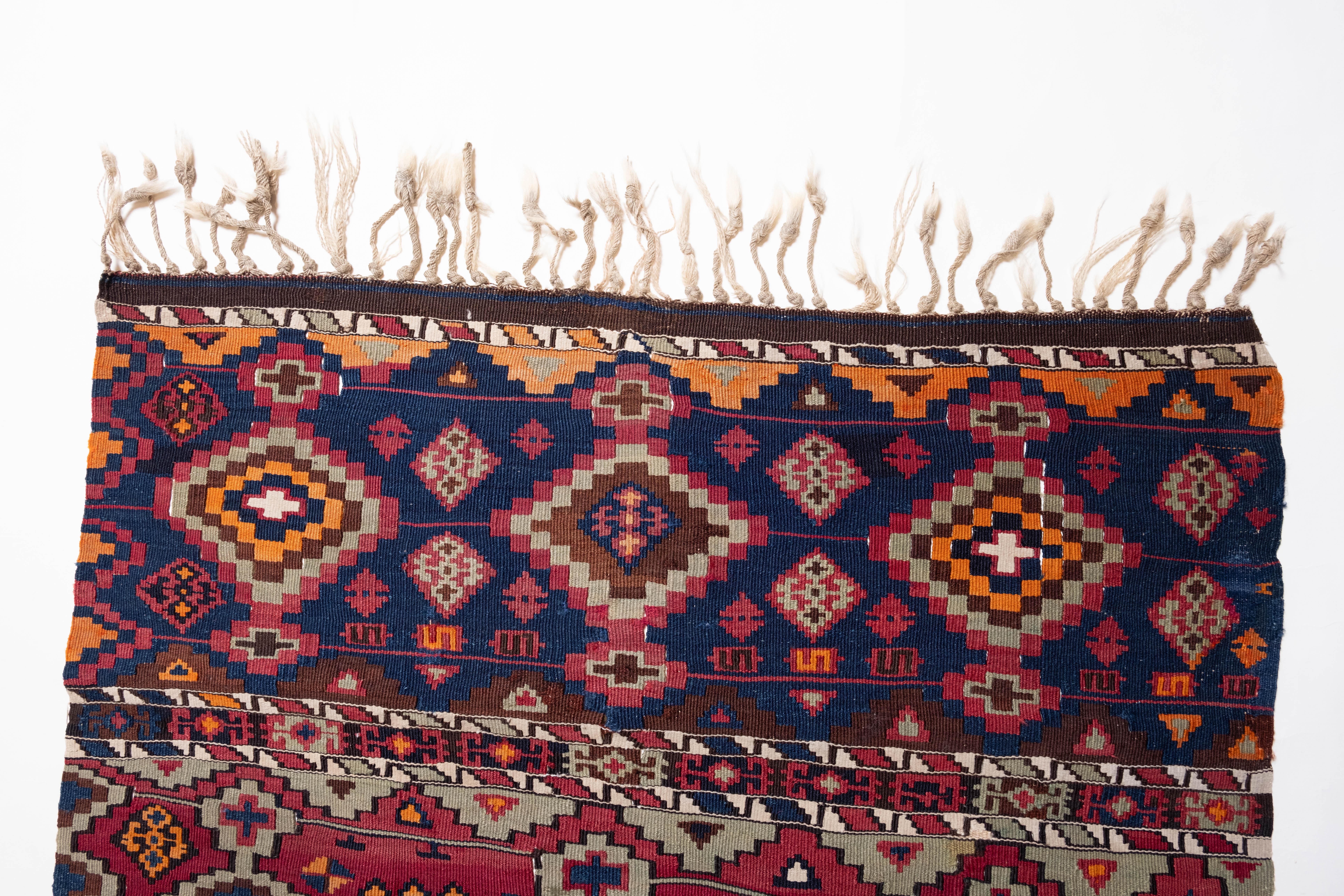 This is an Antique runner Kilim from the Aleppo region with a rare and beautiful color composition and metallic threads.

The strong colors and borderless horizontal striped design are some of the characteristics found in Malatian kilims.
Fringe