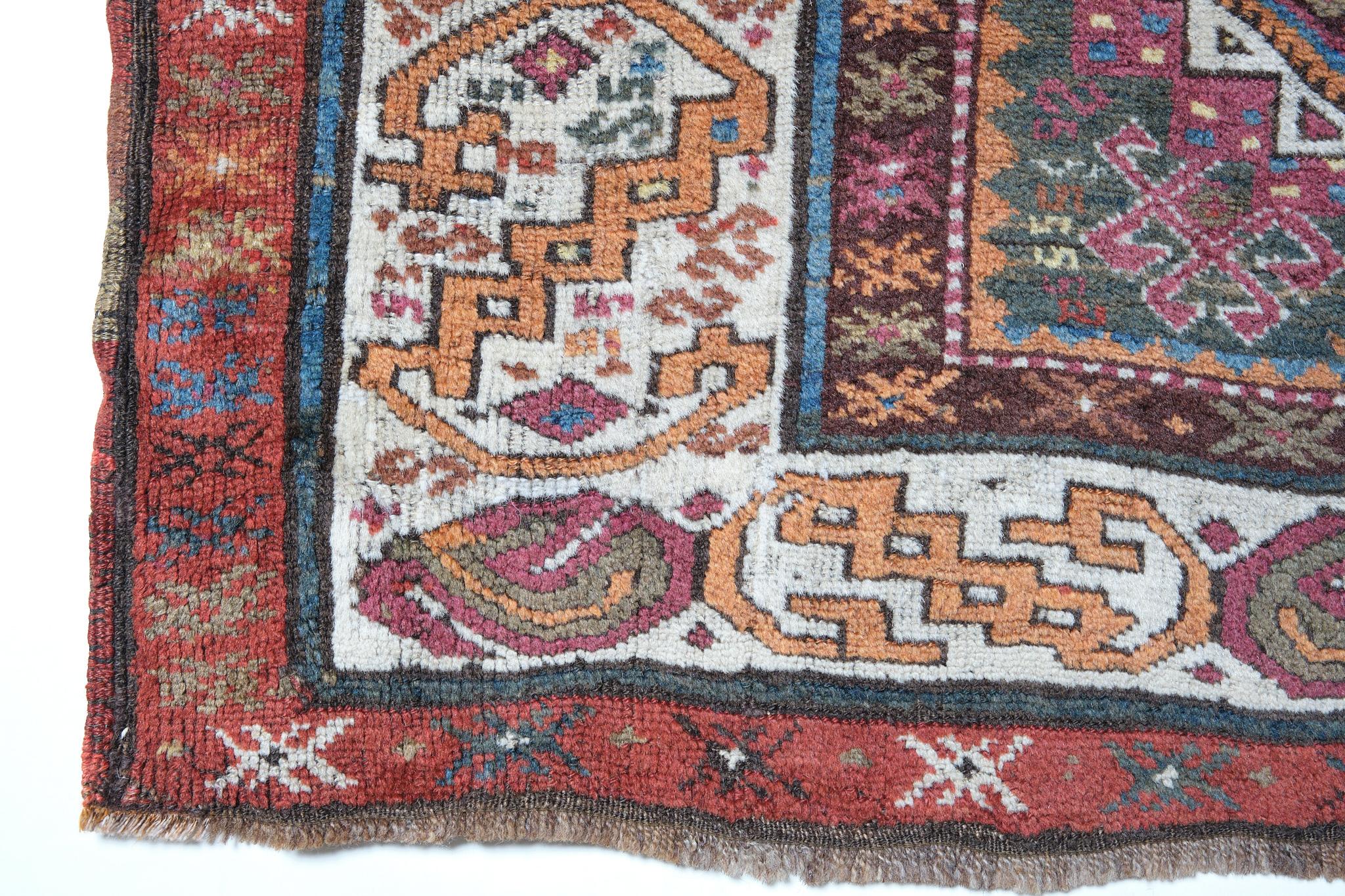 This is an antique runner rug from the Caucasus region with a rare and beautiful color composition.

Of all the rugs of the oriental world, it is the work of the Caucasian weavers that has been most revered since ancient times. The superlative