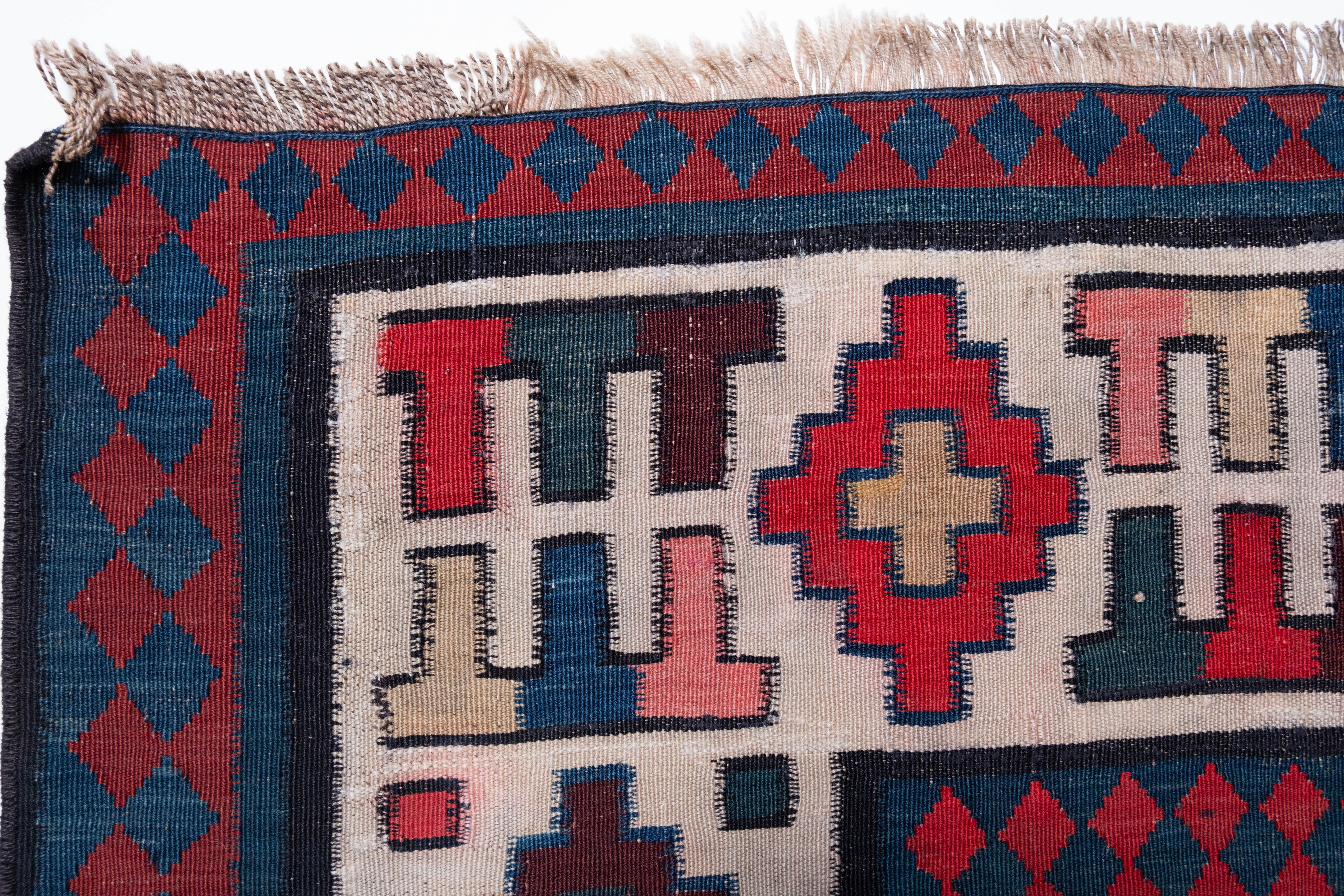 This is a large Antique Talish Kilim from the Caucasus region with a rare and beautiful color composition.

Of the four countries that make up the Caucasus, Azerbaijan produces the most kilims, and the land has a long history of weaving. The nomadic