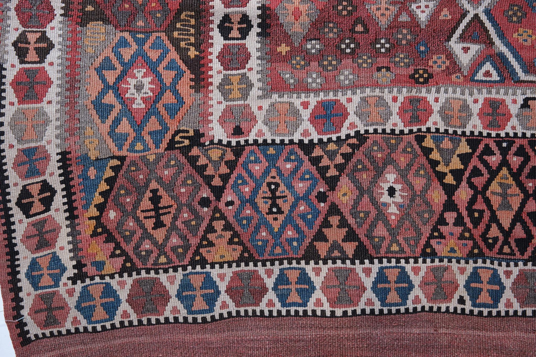 This is an Eastern Anatolian Antique Kilim from the Erzurum region with a rare and beautiful color composition.

Erzurum was once a key frontier town, used to defend Anatolia against many invasions, and was also an important point on the caravan