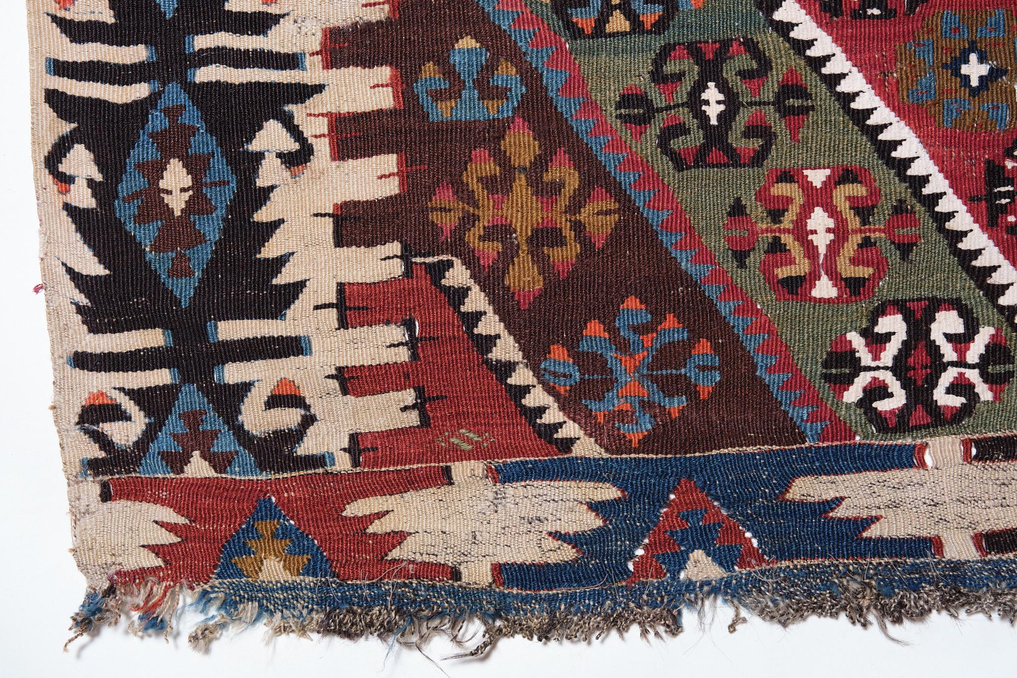 This is a large antique Central Anatolian Kilim from the Kayseri region with a rare and beautiful color composition.

It has a Kayseri-like medallion pattern, but it is characterized by its unique and beautiful use of color. Deep and chic, yet