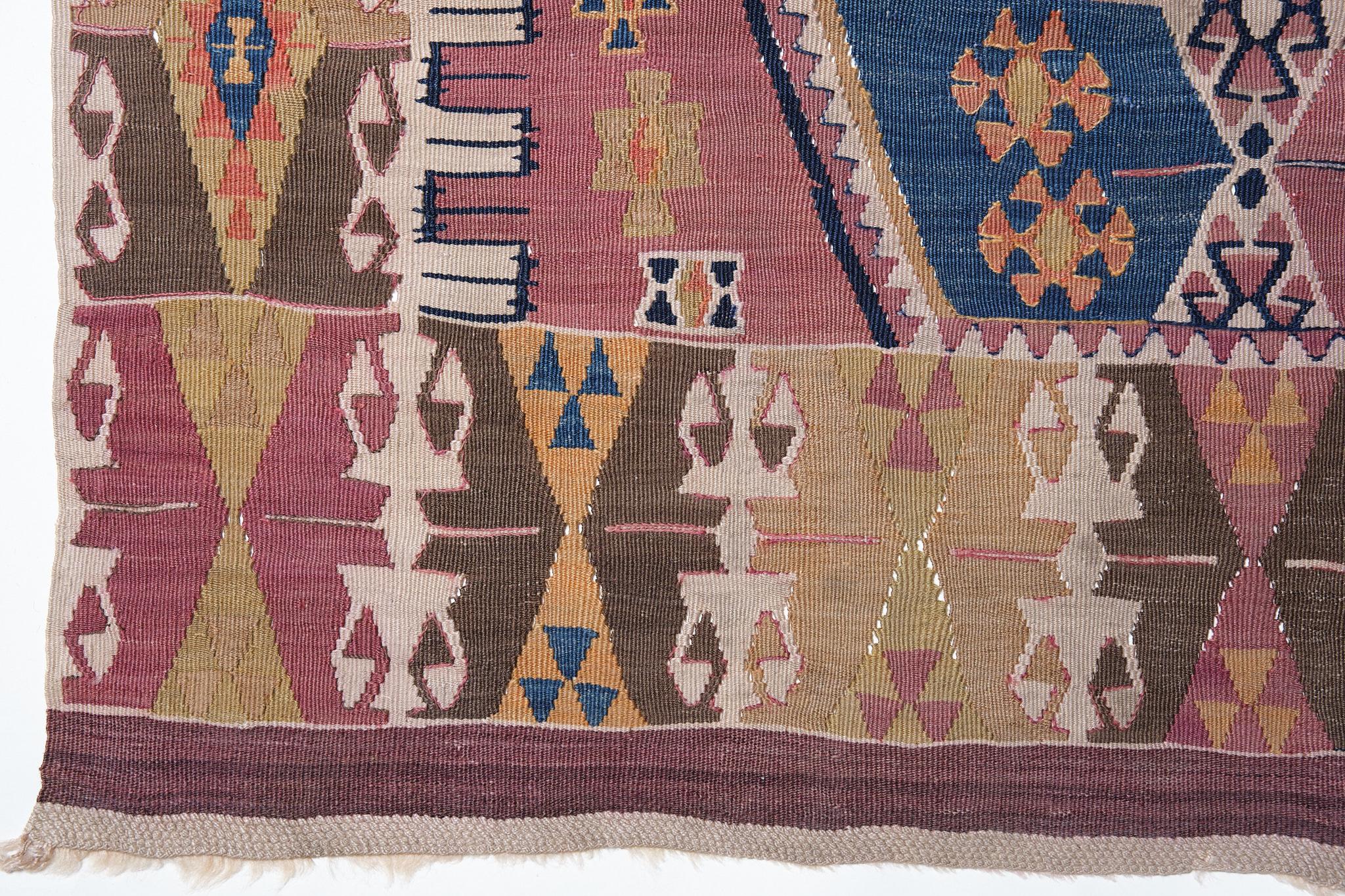 This is a Southern Anatolian Antique Kilim from the Malatya region with a rare and beautiful color composition.

Malatya is one of the leading producers of kilims in Turkey. Fertile land and high-quality wool, originally a Kurdish town, was an