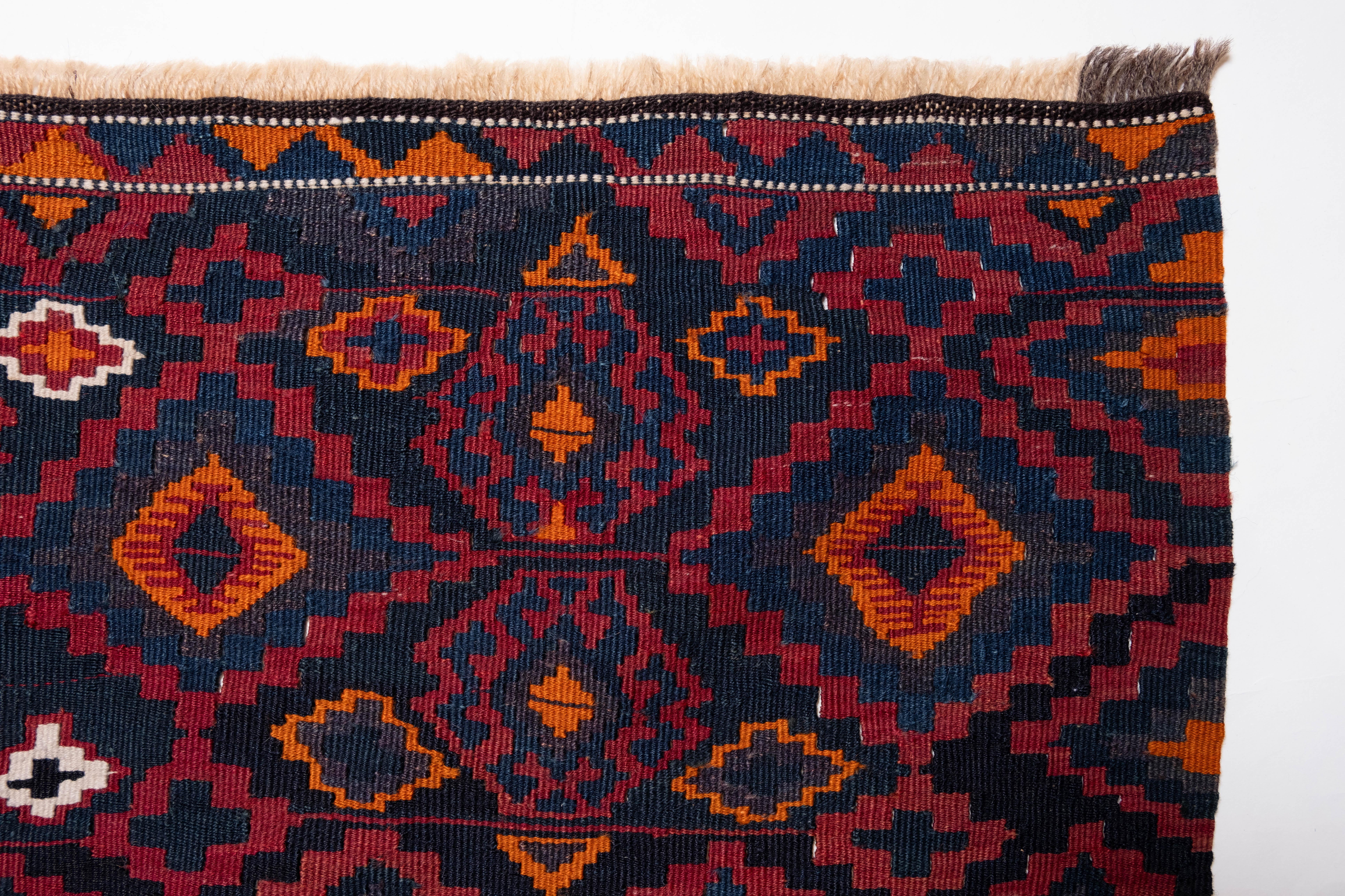 This is a South Eastern Anatolian Antique runner Kilim from the Malatya region with a rare and beautiful color composition.

Malatya is Turkey's main kilim production area, and there are many variations. This is one of them, a runner-type kilim. The