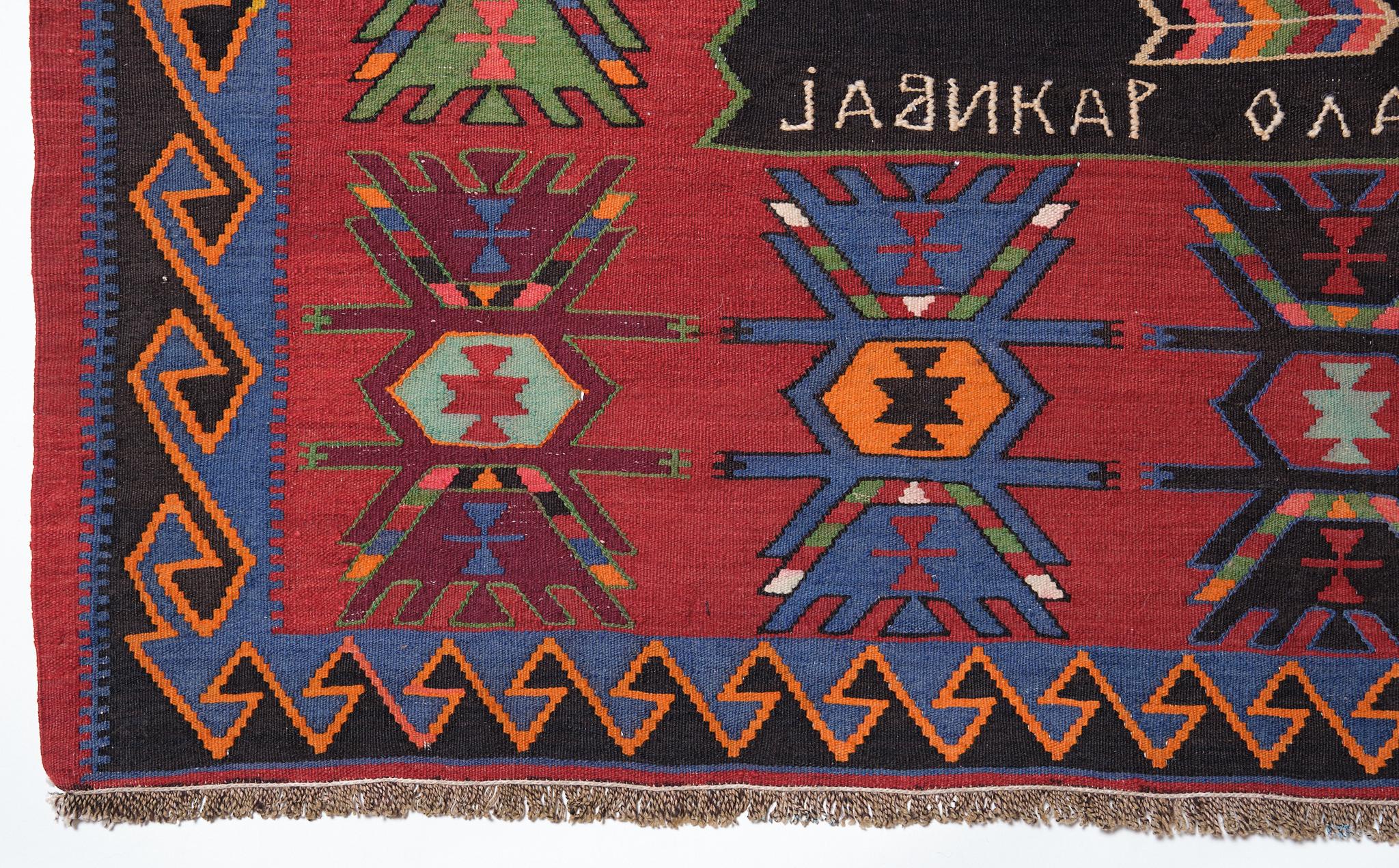 This is a large, Caucasian Old Kilim from the Kuba region with a red background and beautiful color composition.

This Kilim is from Kuba, a city in Azerbaijan in the Caucasus region. It is characterized by bright colors using strong dyed colors.