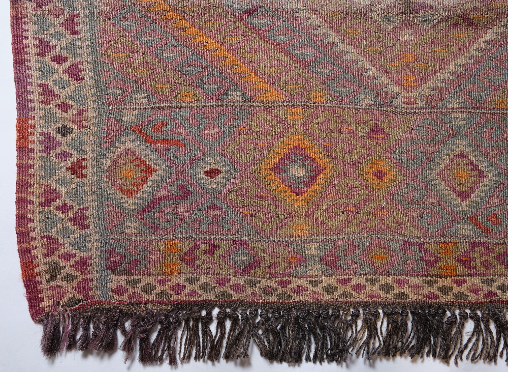 This is a Vintage Old Anatolian Kilim Rug from Turkey with a rare and beautiful color composition.

A long size old kilim with a width of about 1m and a length of about 3.5m can be placed not only in the living room but also in
the corridor