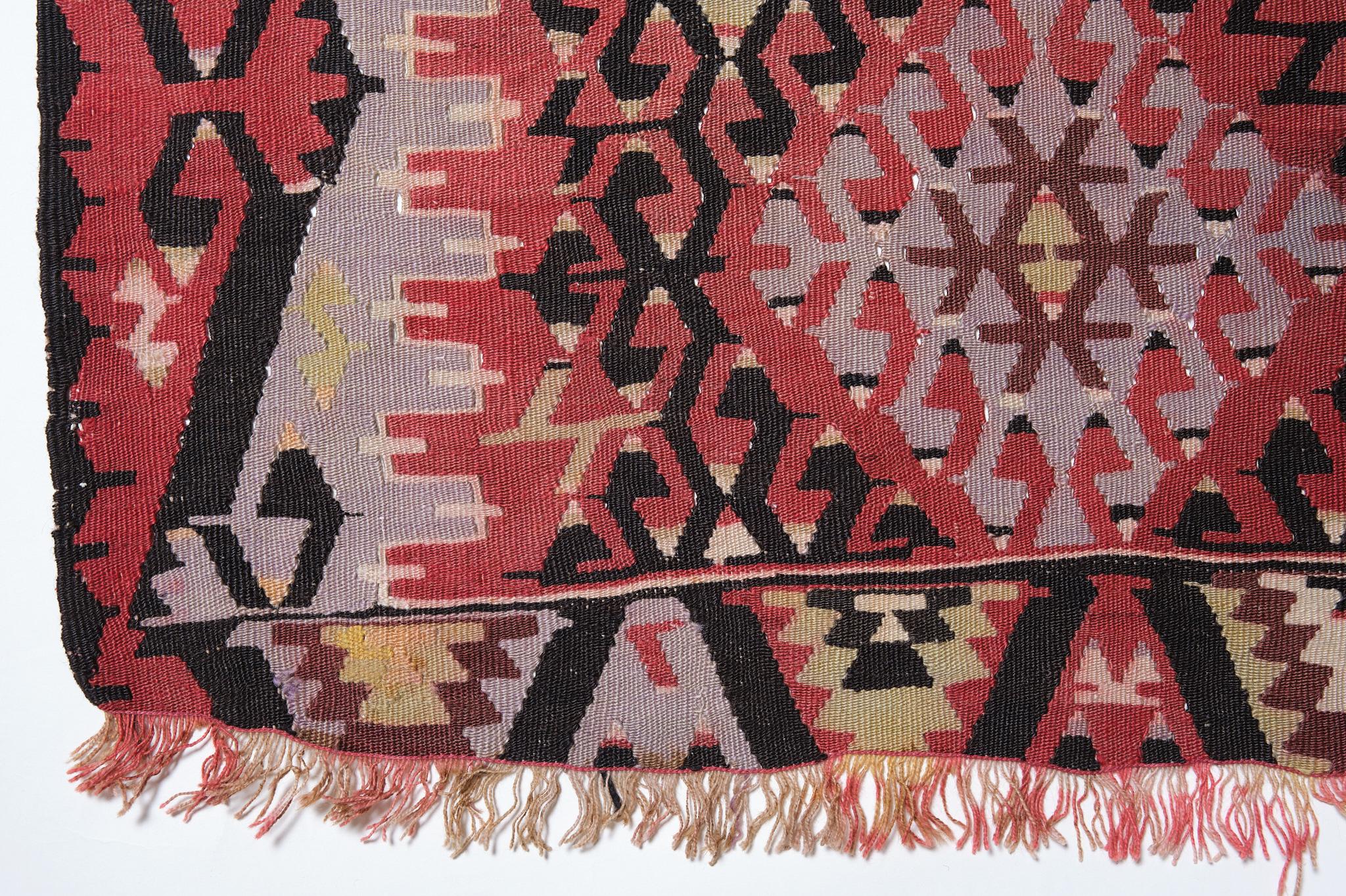 This is a Western Anatolian vintage Kilim from the Esme ( Eshme ) region with a rare and beautiful color composition.

This type of large Esme Kilims often features hexagonal medallions, either arranged in pairs or woven singly as central motifs,