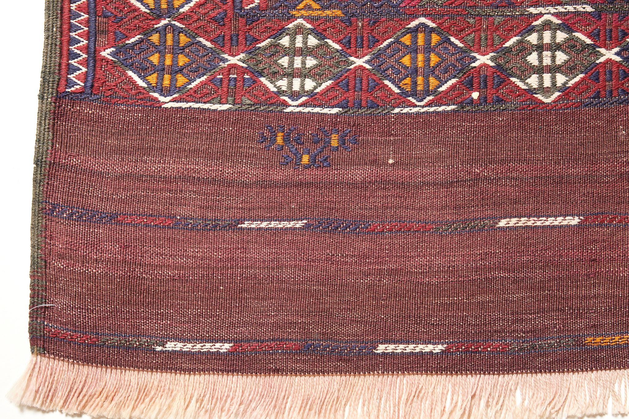 This is a Central Asian Old Yomut Kilim from the West Turkestan and Iran region with a rare and beautiful color composition.

The Yomut are to be found in north-east Iran, and across the border in west Turkestan close to the Caspian Sea. There is