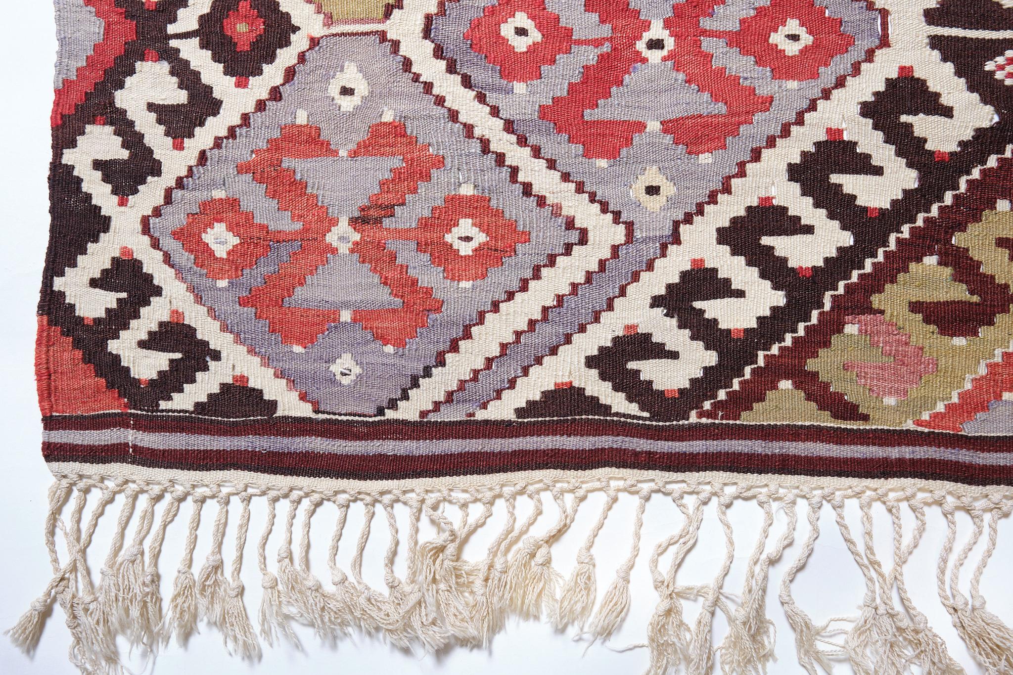 This is a South Anatolian old vintage Kilim from the Antalya region with a rare and beautiful color composition.

Founded in 200 BC by Attalus II, king of Pergamum, Antalya, then named Attaleia, has always been a bustling port. During the
