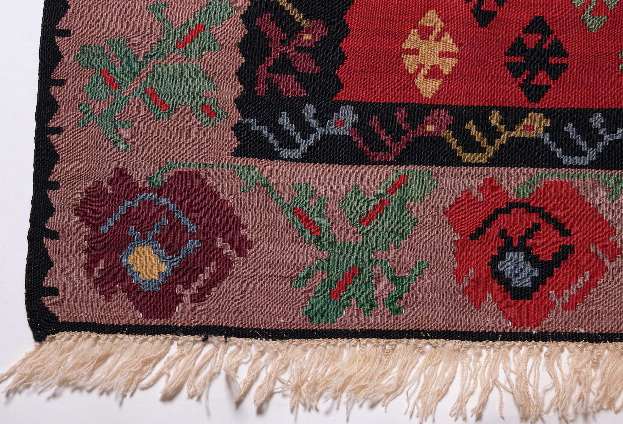This is a vintage Old Sarkoy Kilim rug from Western Turkey with a rare and beautiful color composition.

Sarkoy kilims are very finely woven in slitweave in a variety of sizes and are made in one piece. Many feature the tree of life composition