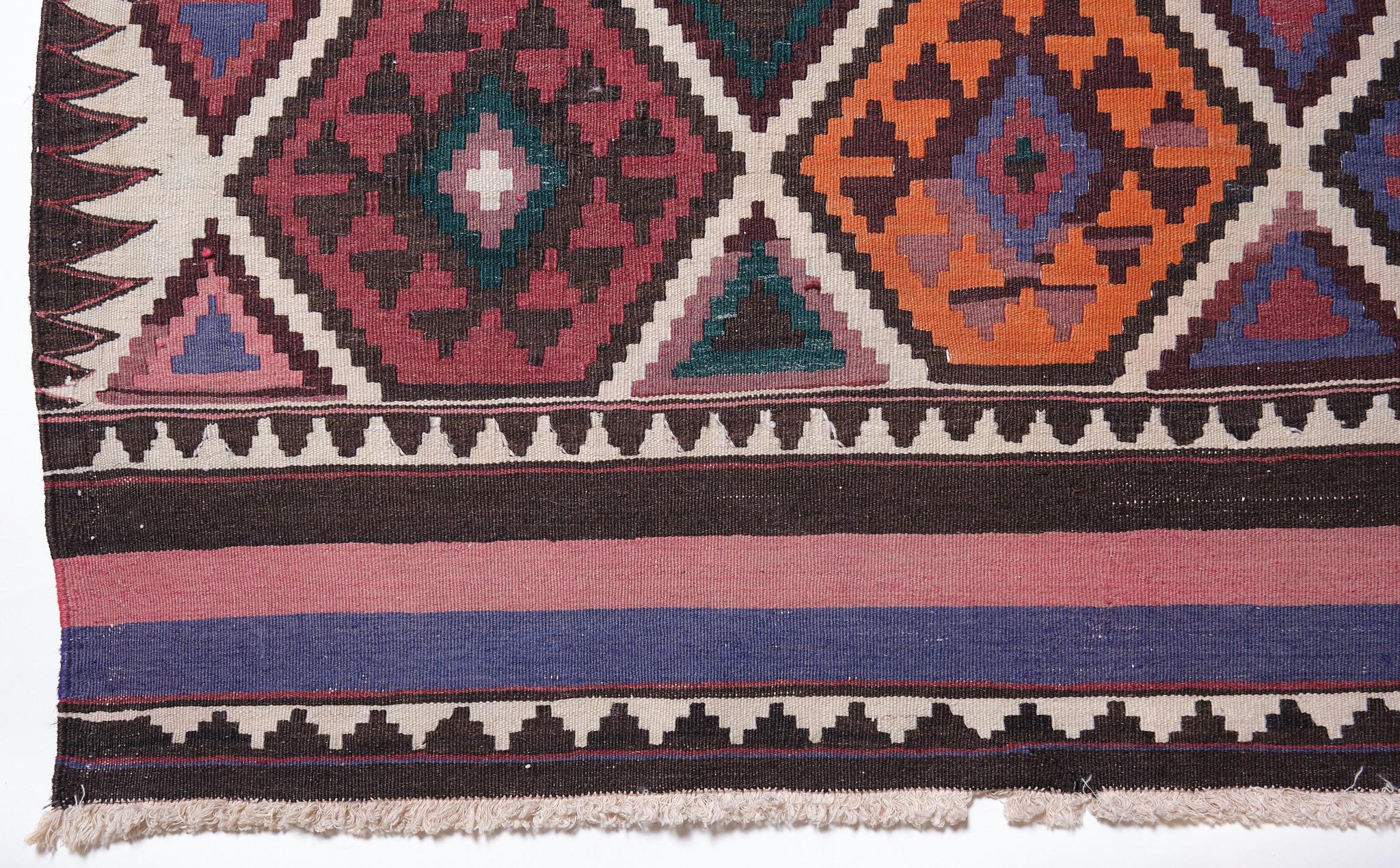 This is an old Shirvan Kilim from the Caucasus region with a rare and beautiful color composition.

Of the four countries that make up the Caucasus, Azerbaijan produces the most kilims, and the land has a long history of weaving. The nomadic