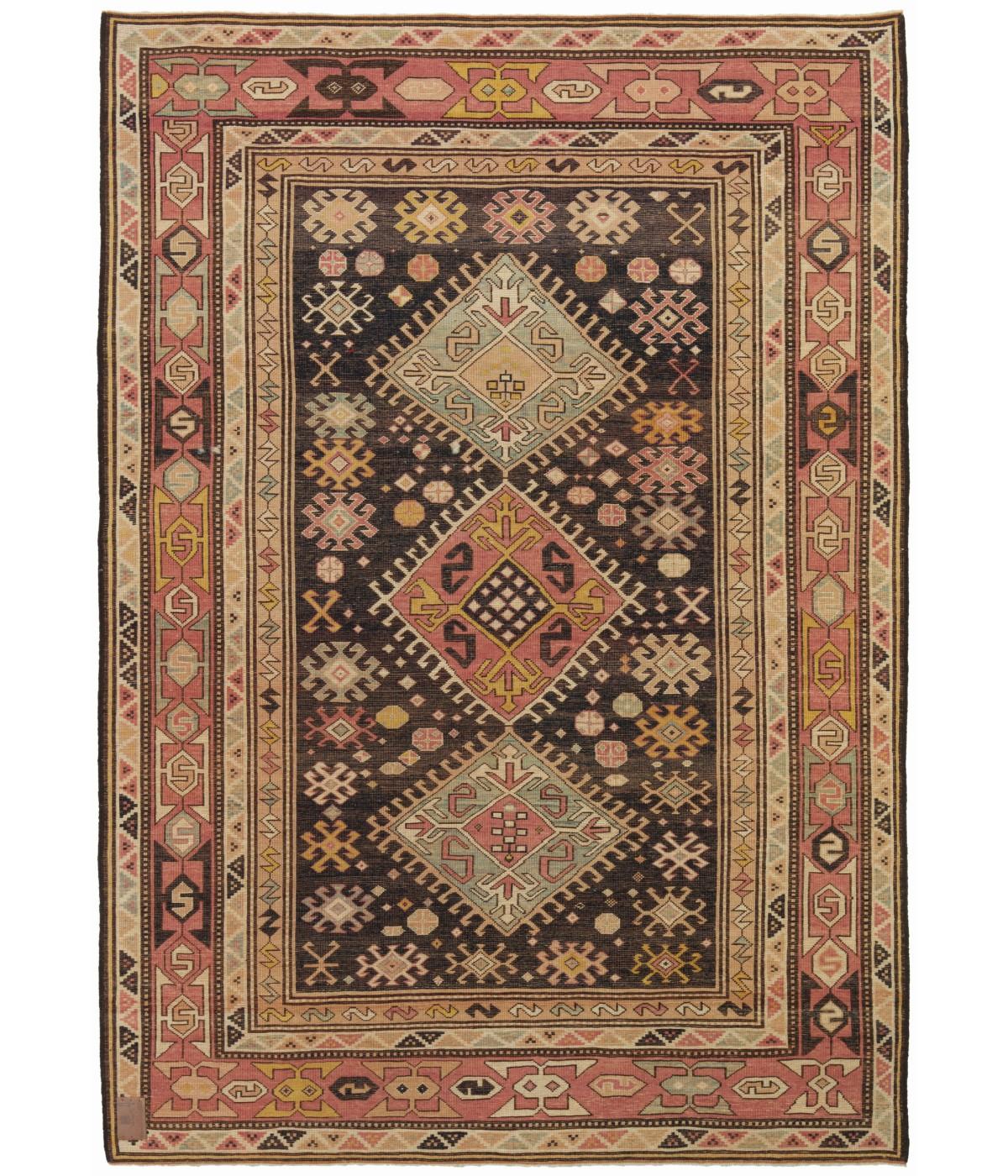 Kazak Rug with Hooked Medallions
This is a complete hooked field with double medallions rug from the late 19th century, Kazak region, Caucasus area. A striking field design features three medallions each with concentric hook motifs, with S patterns