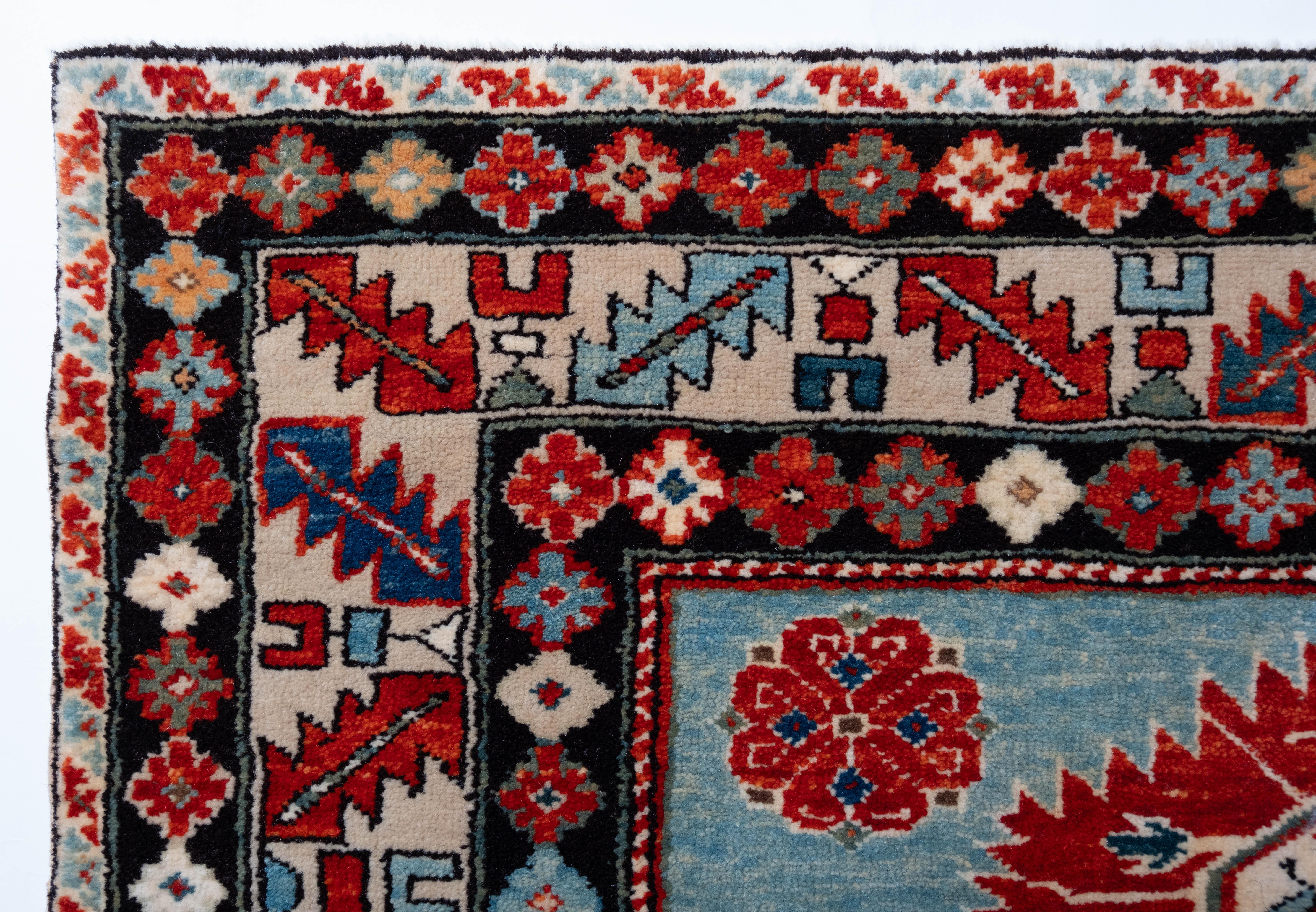 The source of the rug comes from the book Oriental Rugs Volume 1 Caucasian, Ian Bennett, Oriental Textile Press, Aberdeen 1993, pg.247. This is a Harshang design rug with palmettes from the early 19th century, Kuba region, Caucasus area. This is a