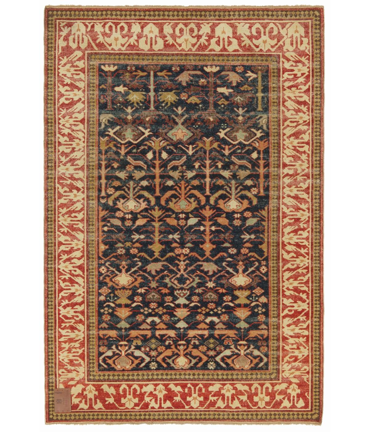 Kuba Rug with Ascending Palmettes and Flowers
The source of the rug comes from the book Orient Star – A Carpet Collection, E. Heinrich Kirchheim, Hali Publications Ltd, 1993 nr.27. This is an ascending palmettes and flowers design rug from the 18th