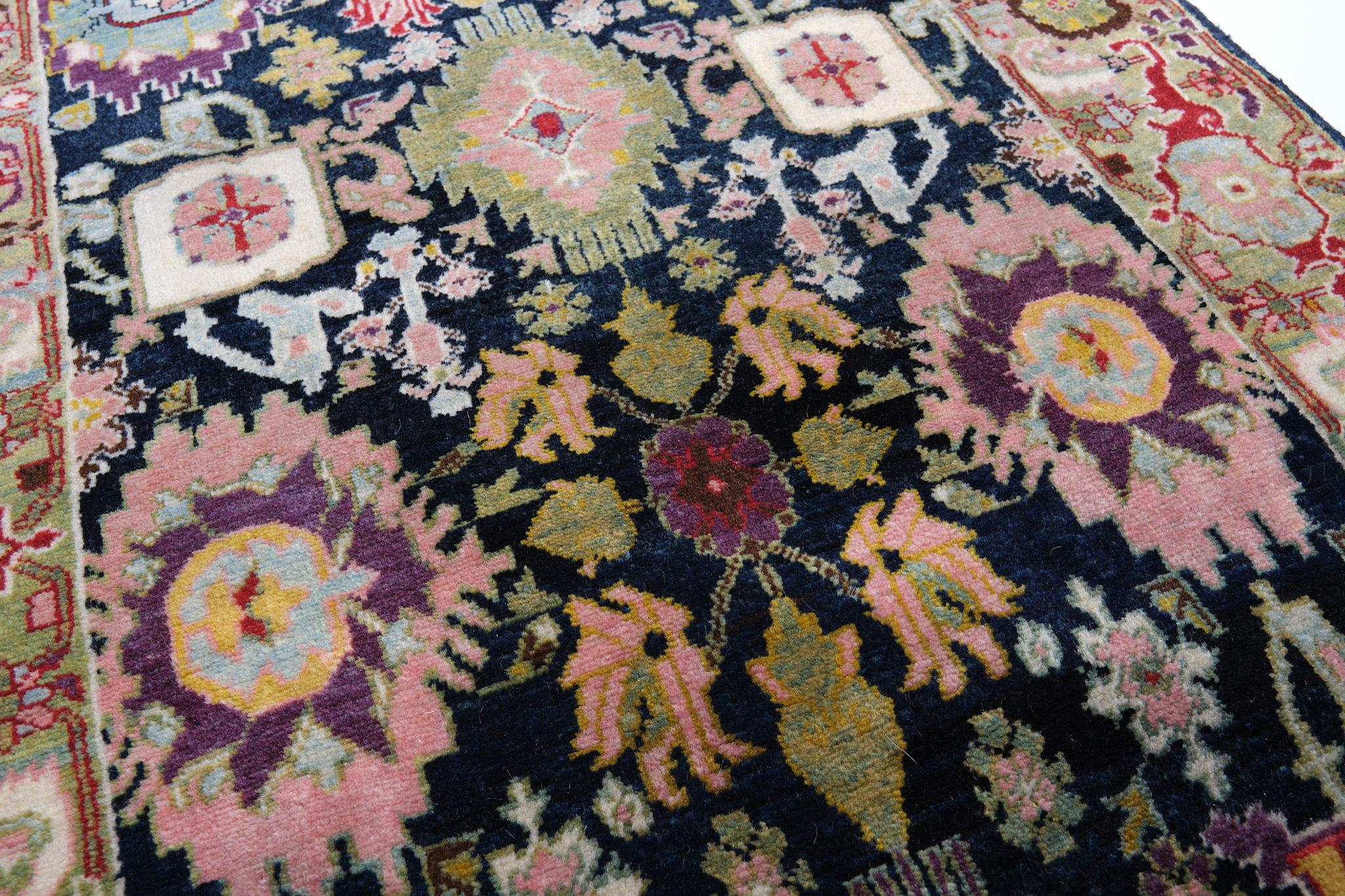 This offset pattern is composed of palmettes and flowers, one has the impression that it is only part of a larger scheme designed 19th century rug from the Bidjar region, Eastern Kurdistan area. Very similar palmettes, drawn in a curvilinear manner