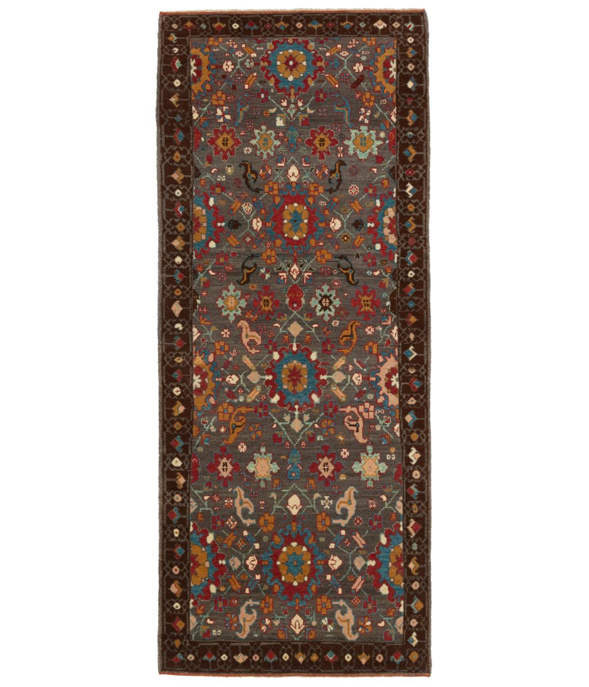 This offset pattern is composed of palmettes and flowers, one has the impression that it is only part of a larger scheme designed 19th-century rug from the Bidjar region, Eastern Kurdistan area. Very similar palmettes, drawn in a curvilinear manner