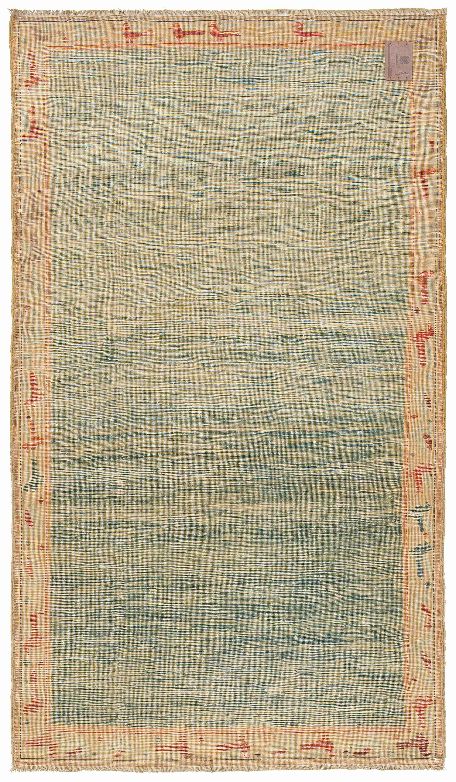 This unique design rug is interpreted by our designers with a mixture of Ararat Rugs’ soft green tone natural dyed hand-spun yarns. This modern rug is reminiscent of a scene in impressionist river paintings, framed with colorful birds.

Color
