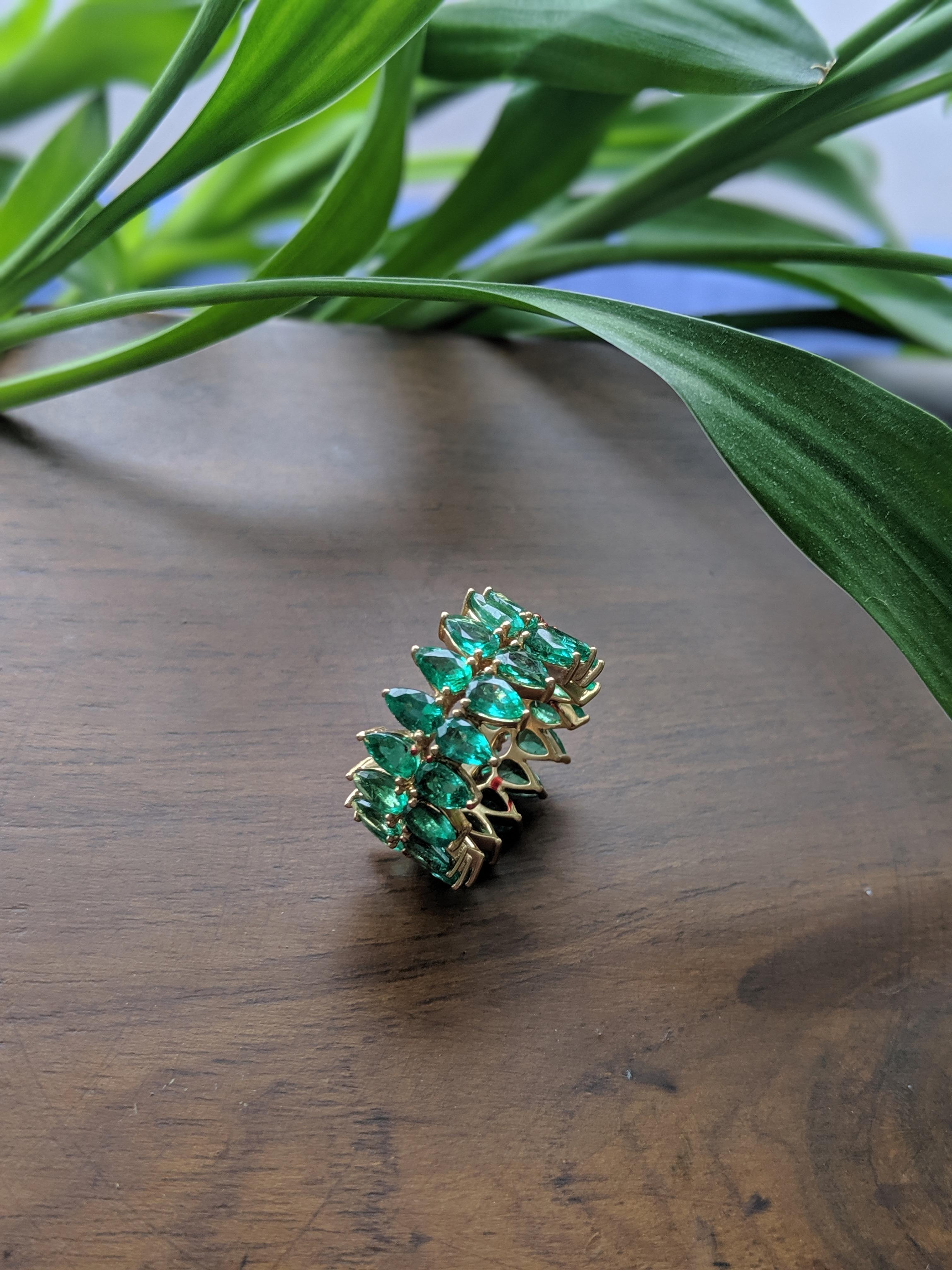 A modern variation of the ARAYA classic, this 0.22 carat pear shaped emerald ring is the perfect addition as a stacked ring, or simply worn on it's own. Set in 18Kt yellow gold, this ring makes up a total emerald weight of 7.50 carats. Additional