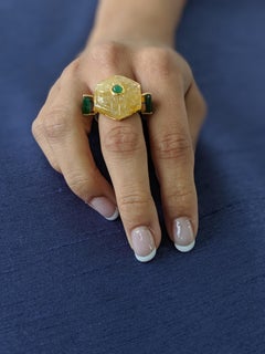 Araya 26.30 Carat Carved Yellow Sapphire and Zambian Emerald Ring