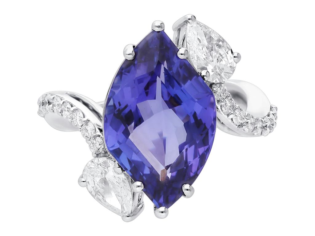 Designed for the modern ARAYA woman, this stunning tanzanite and diamond ring is bound to make a statement. With it's fancy shaped 8.64 carat vivid Tanzanite center stone, this ARAYA creation can add color to any ensemble from day to night. Set in