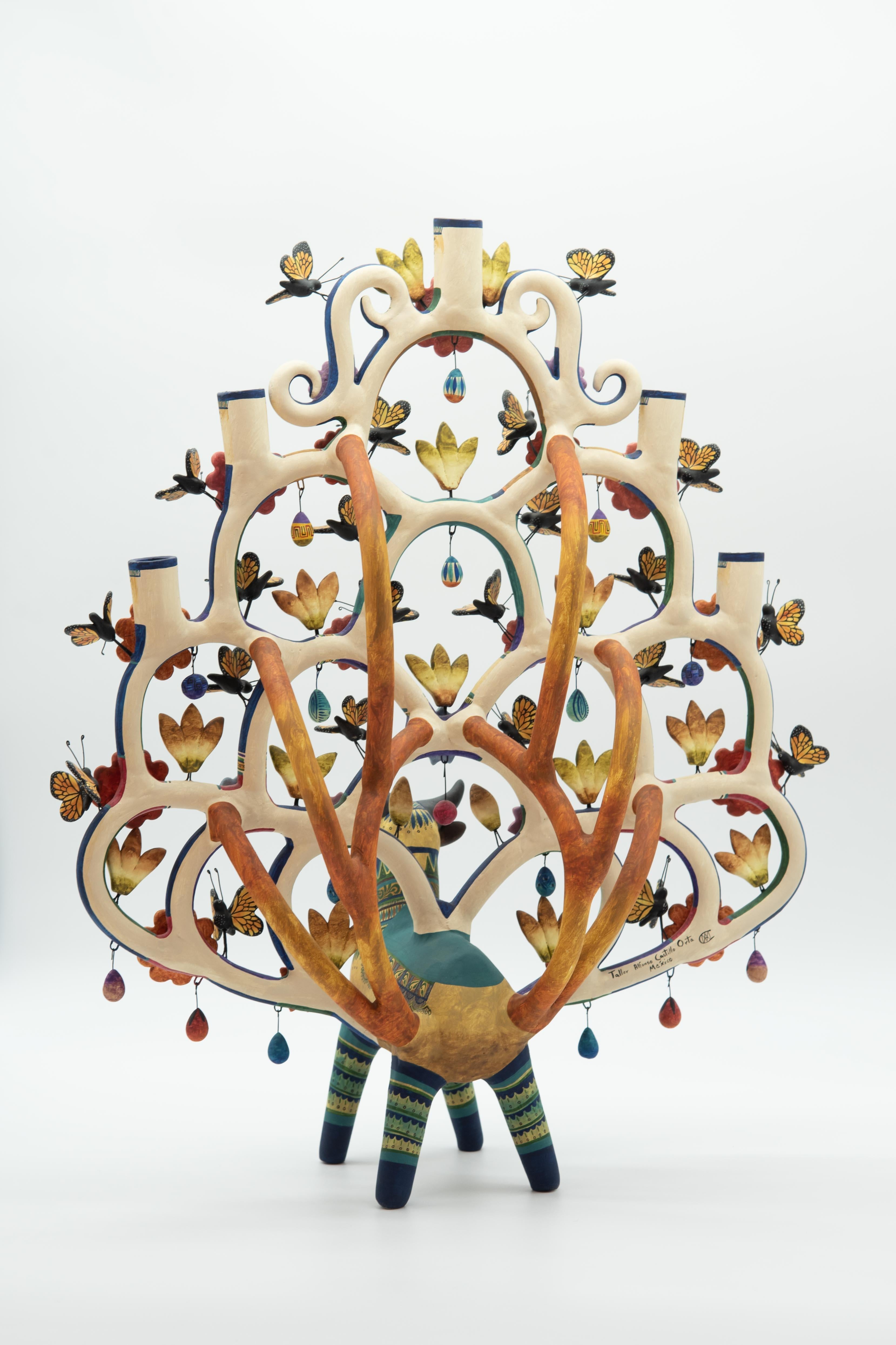 Beautiful folk art piece made by La Familia Castillo. Handmade in clay and painted with acrylic paint.

Created by master artisan Soledad Martha Hernández and her son Marco Antonio Castillo in the town of Izucar de Matamoros, in the state of Puebla,