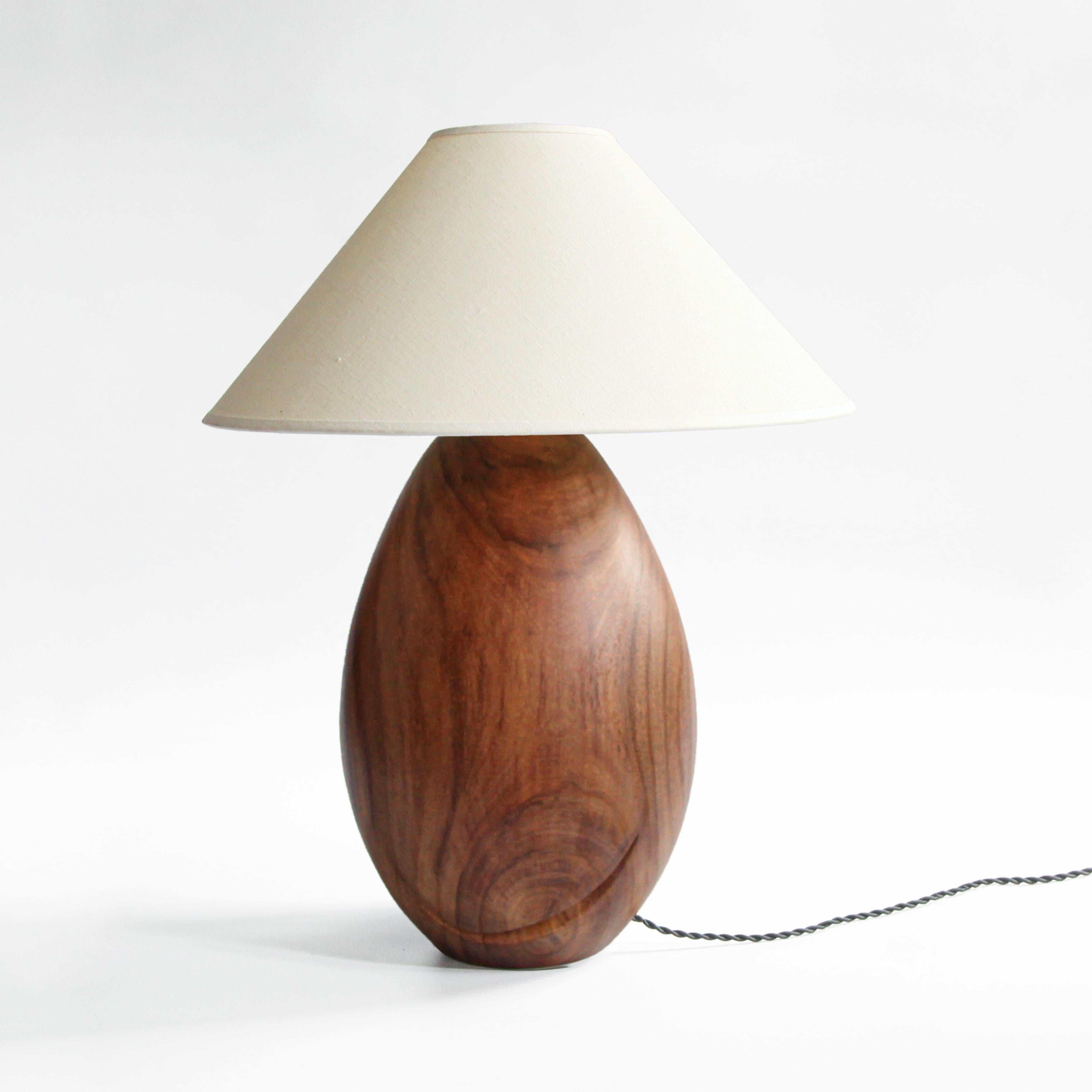 The Árbol collection is an embrace of tropical modernism; each lamp is composed of salvaged tropical hardwoods from the Bolivian city of Santa Cruz, where trees that are felled by natural causes—or for construction—are rescued by our team. A blend